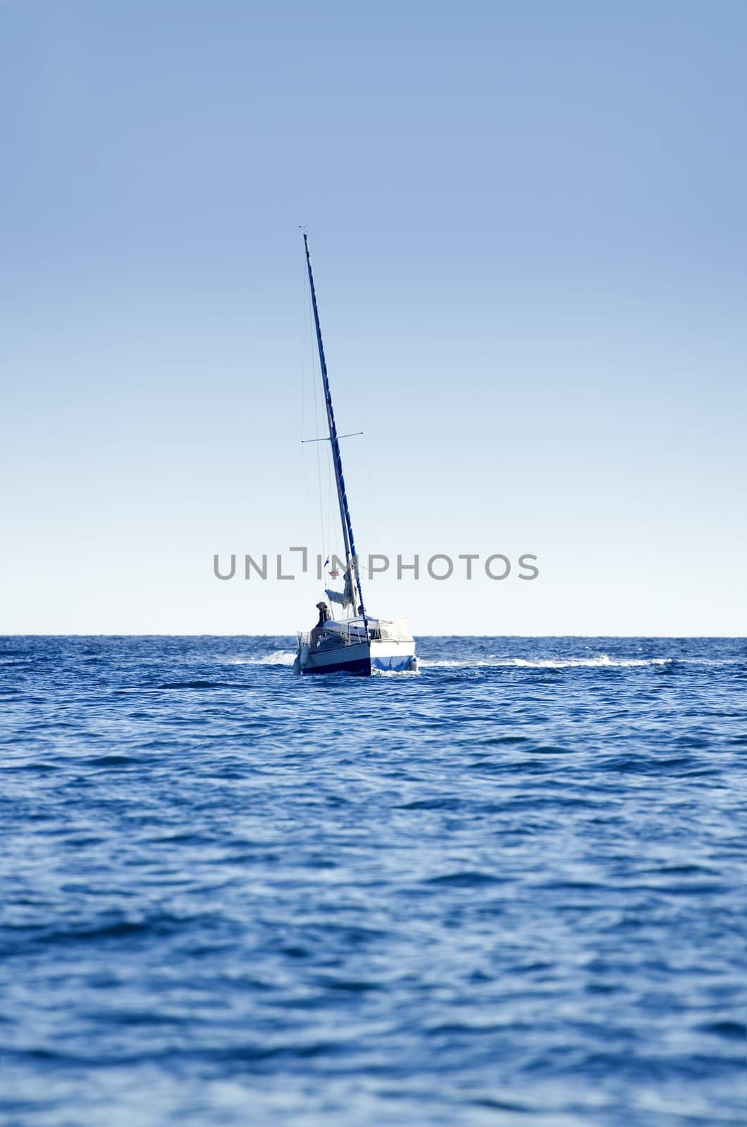 A small boat sailing on a sunny morning