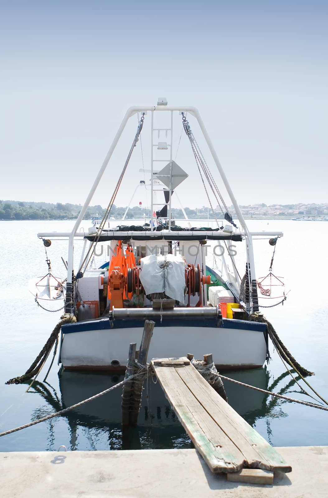 Fishing boat at the docks on a calm sunny day