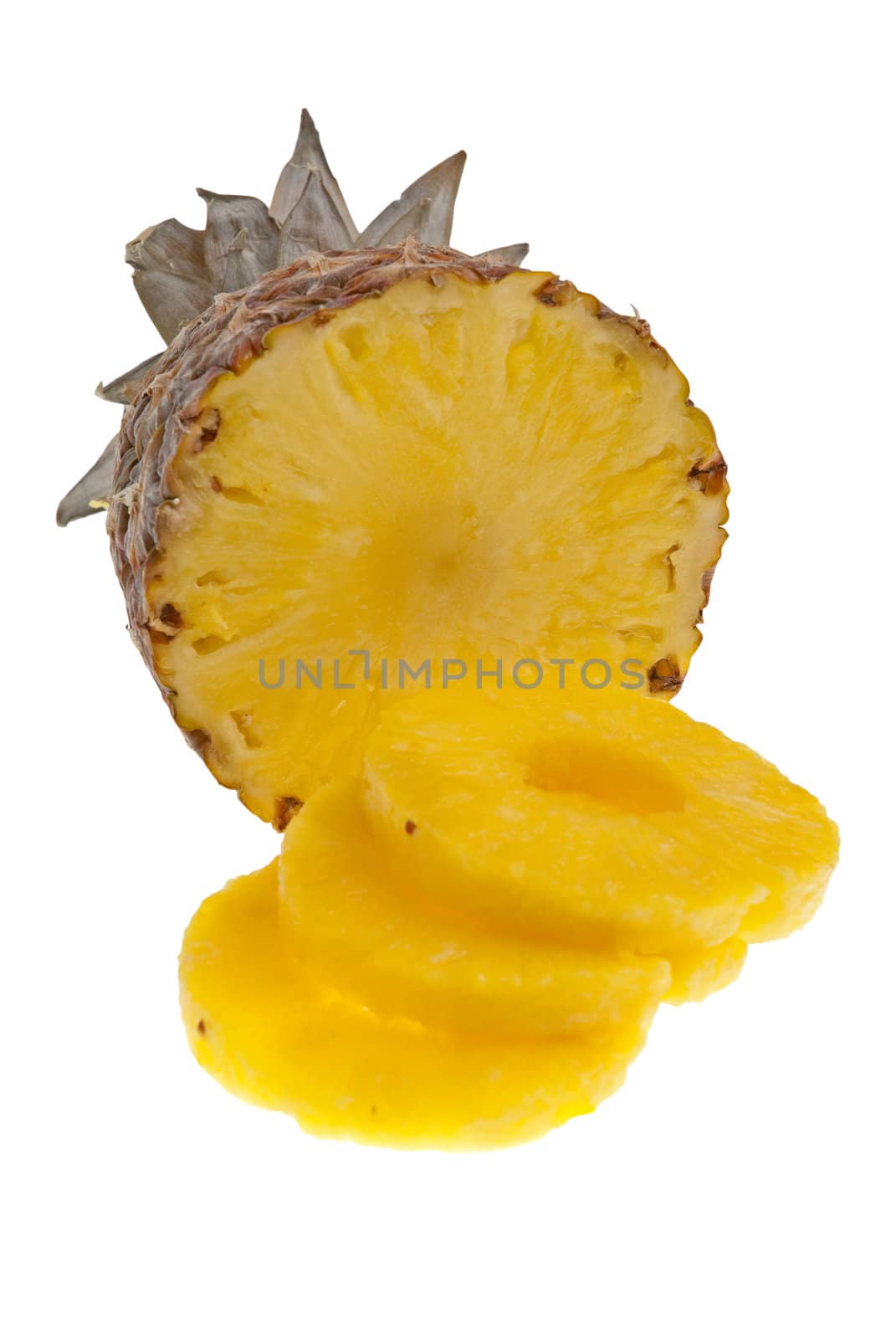 Ripe pineapple with slices isolated on white background.