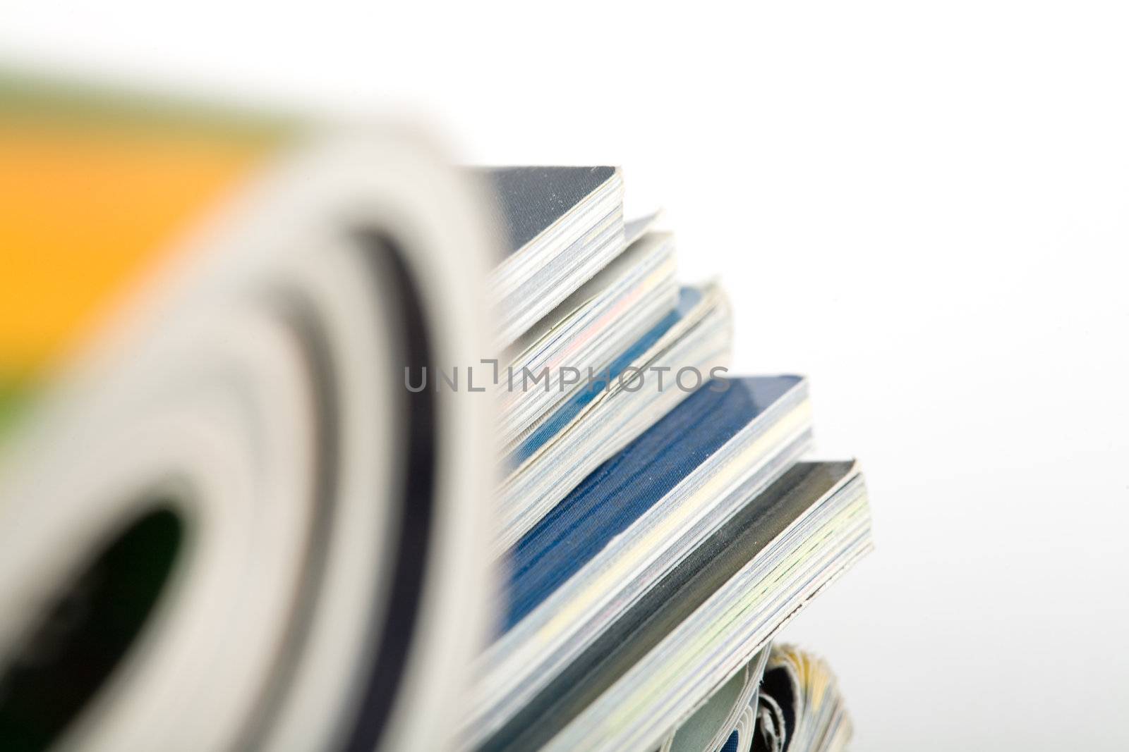 Stack of magazines studio isolated on white background with space for your text