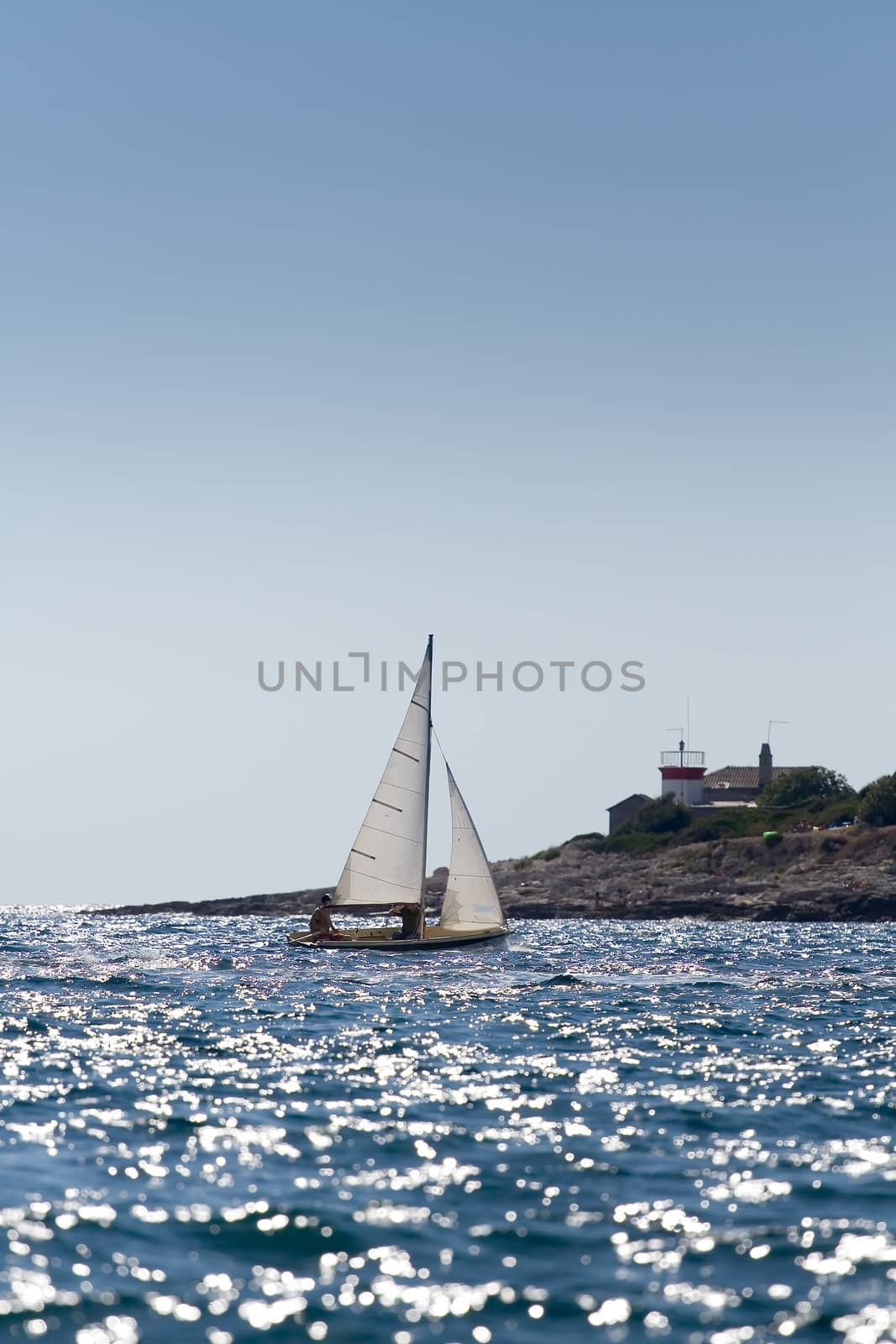 A small boat sailing on a sunny morning