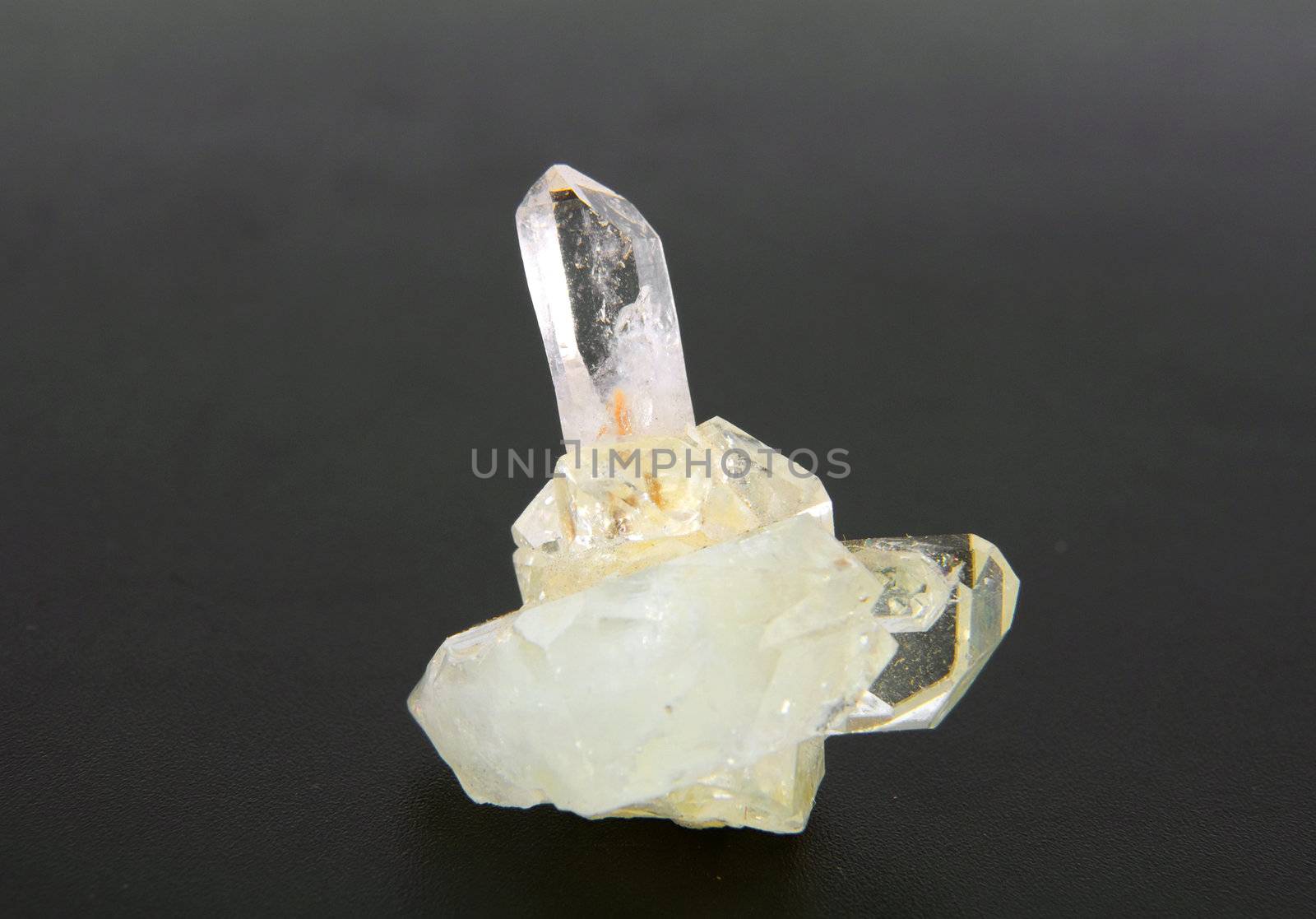 large quartz crystal on a gray background