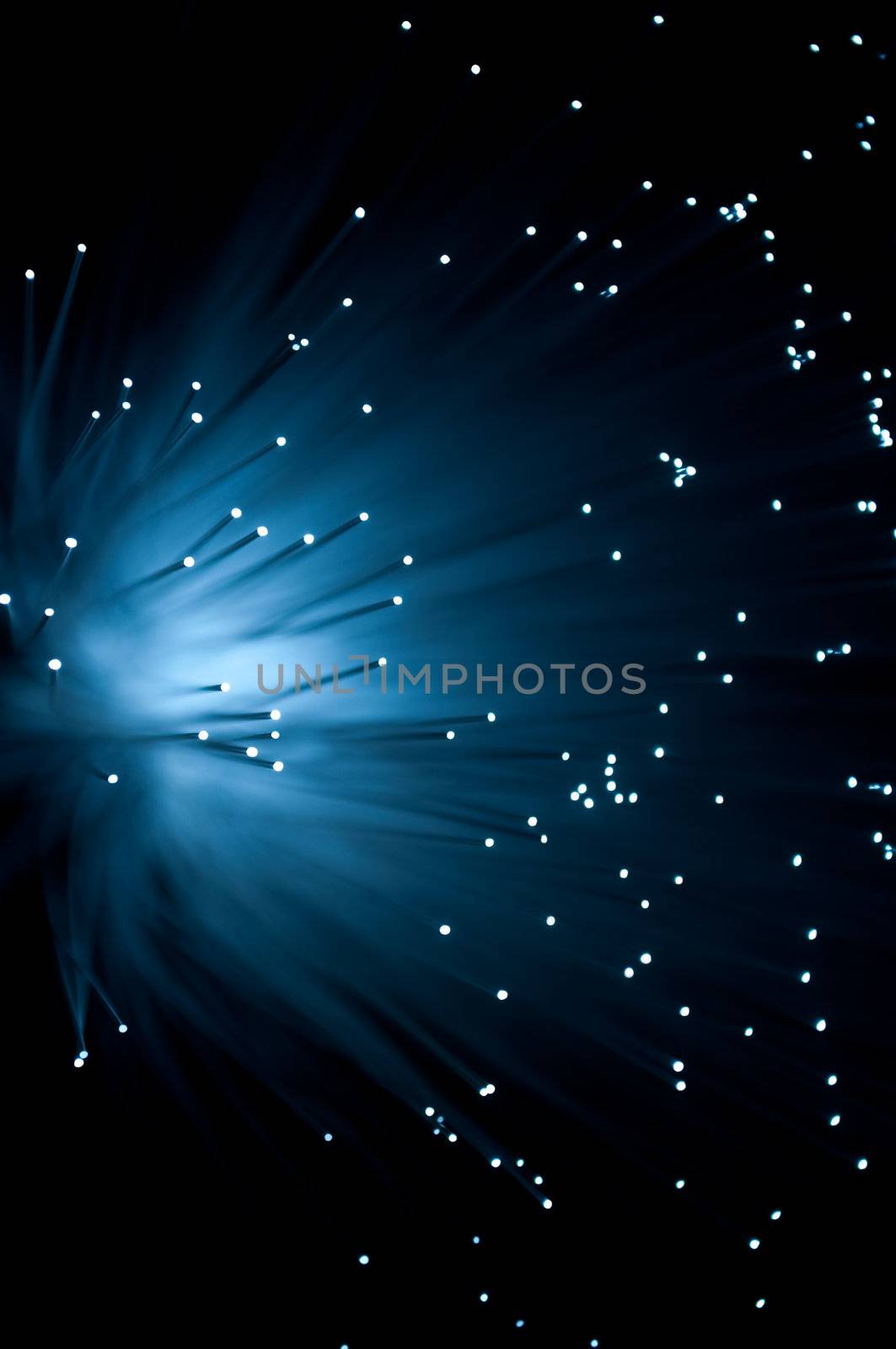 Abstract style capturing the ends of blue fibre optic light strands against a black background.