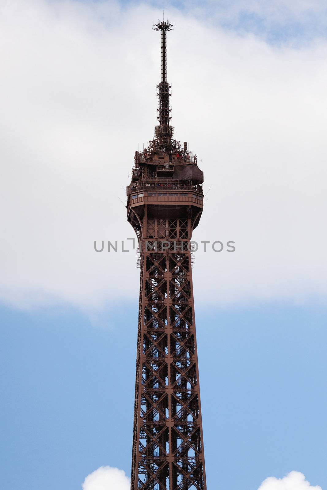 Apex of Eiffel tower on the background sky