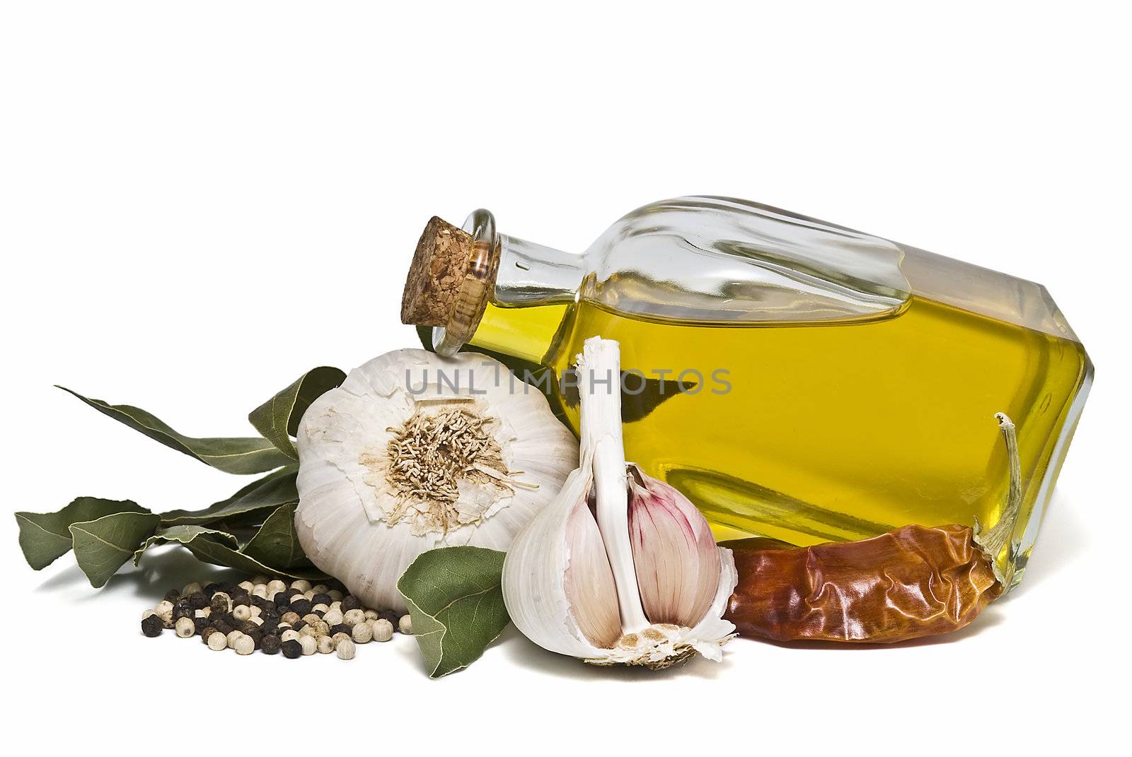 Mediterranean spices and olive oil isolated on a white background.