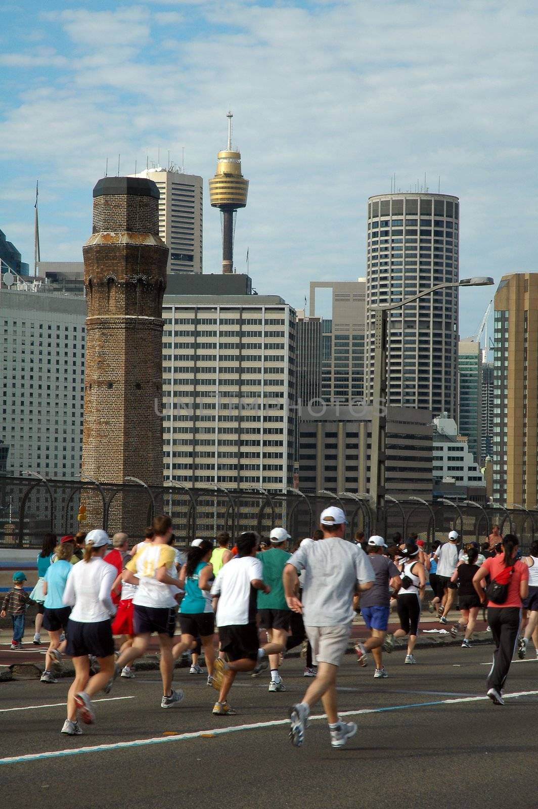 Sydney marathon on harbour bridge, sydney tower in background