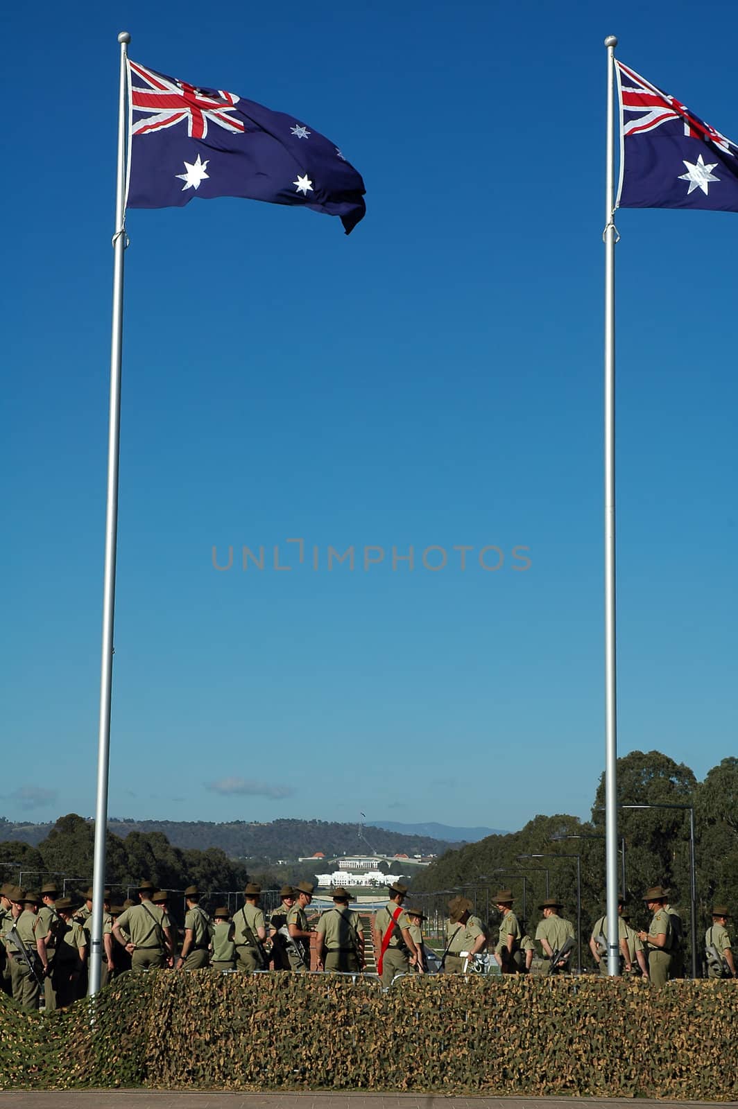australian soldiers, australian flags, Canberra Parliament House in background,