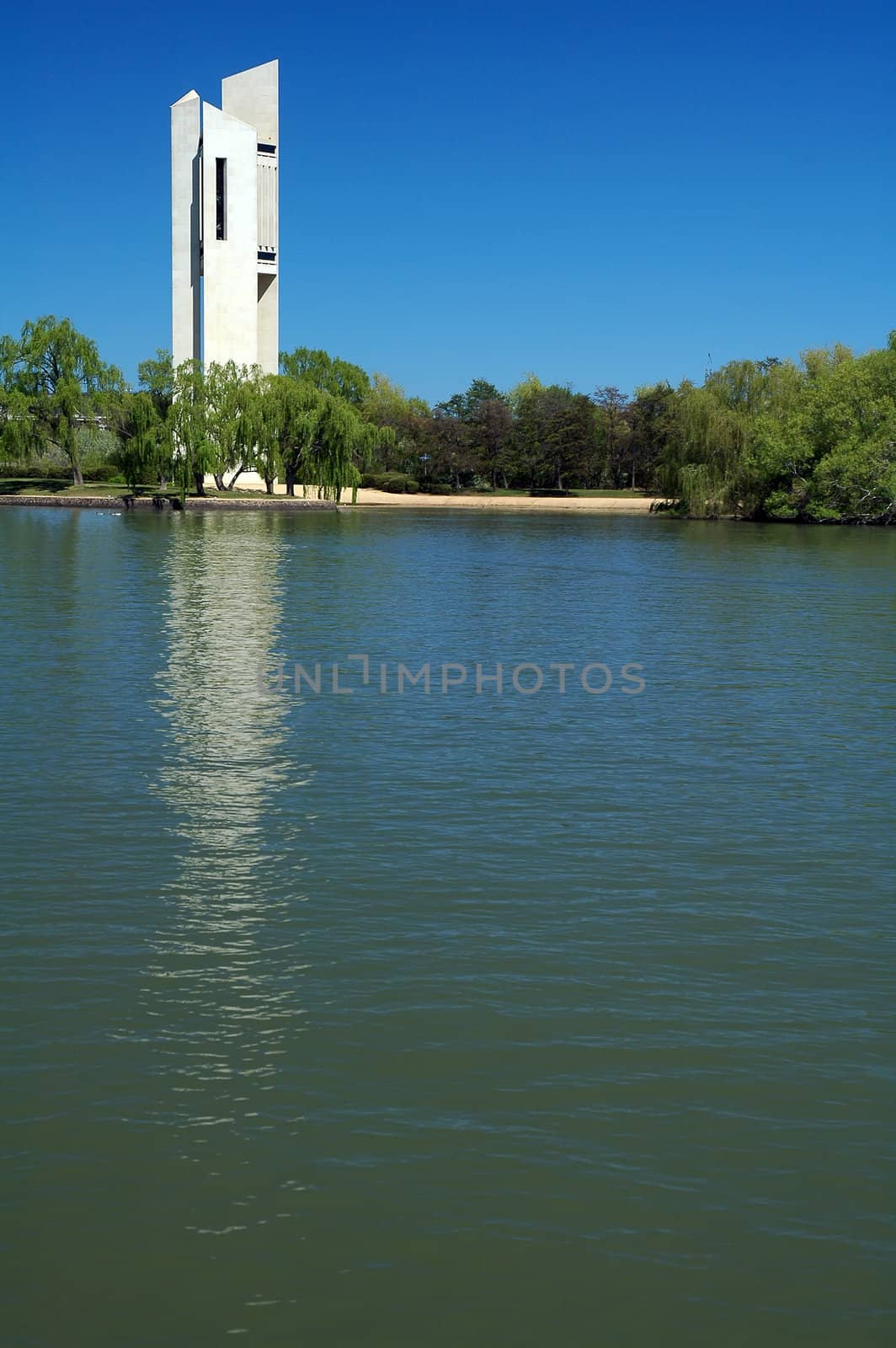 famous white Carillion in Canberra, lake with boat in foreground