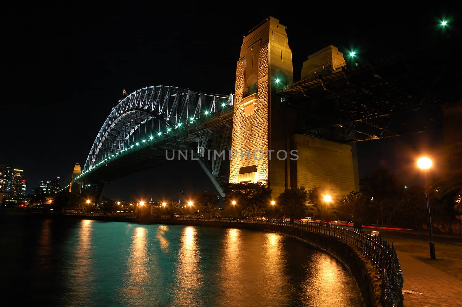 night scene of Harbour Bridge, lights reflected in water, photo taken from Kirribilli