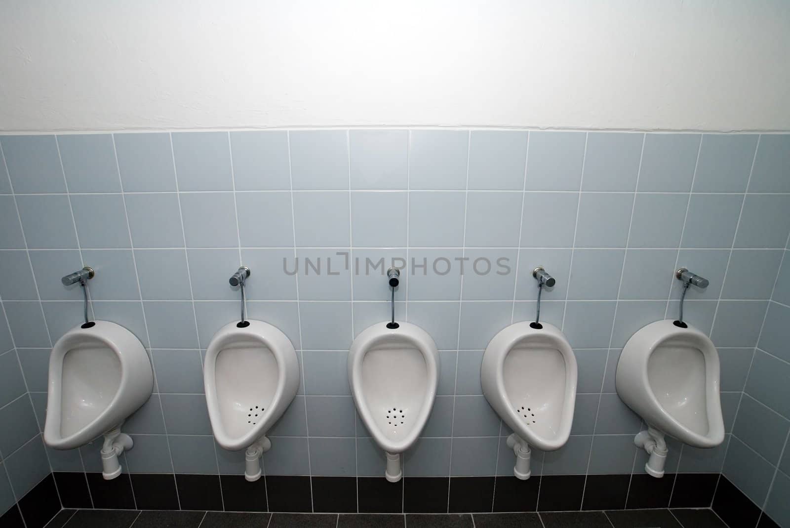 urinal man five clean toilets, no other objects 