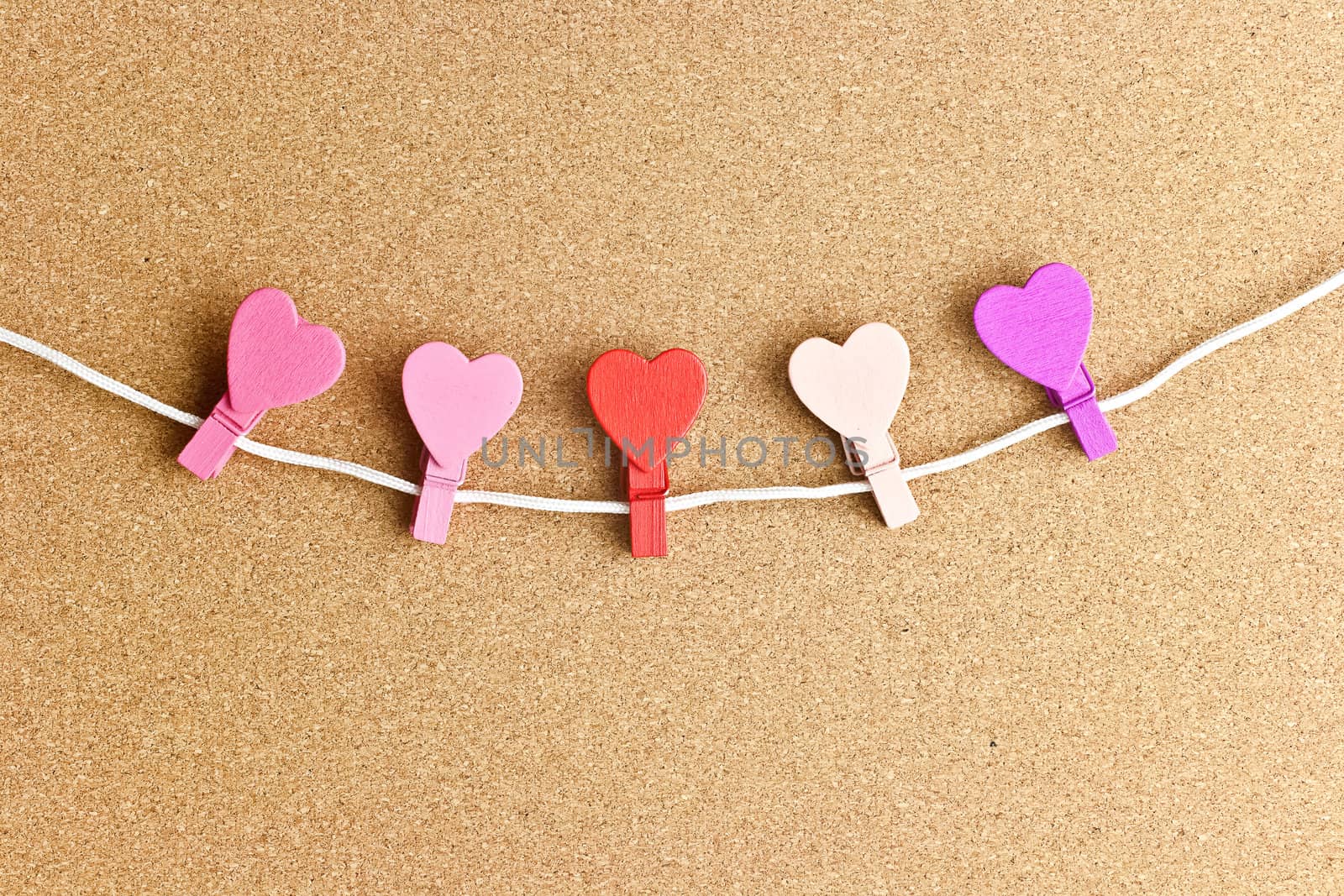 Hearts pinned to the peg on the bulletin board