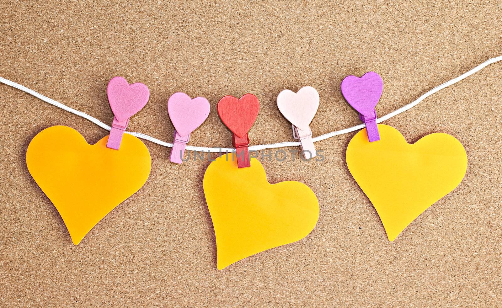Hearts pinned to the peg on the bulletin board