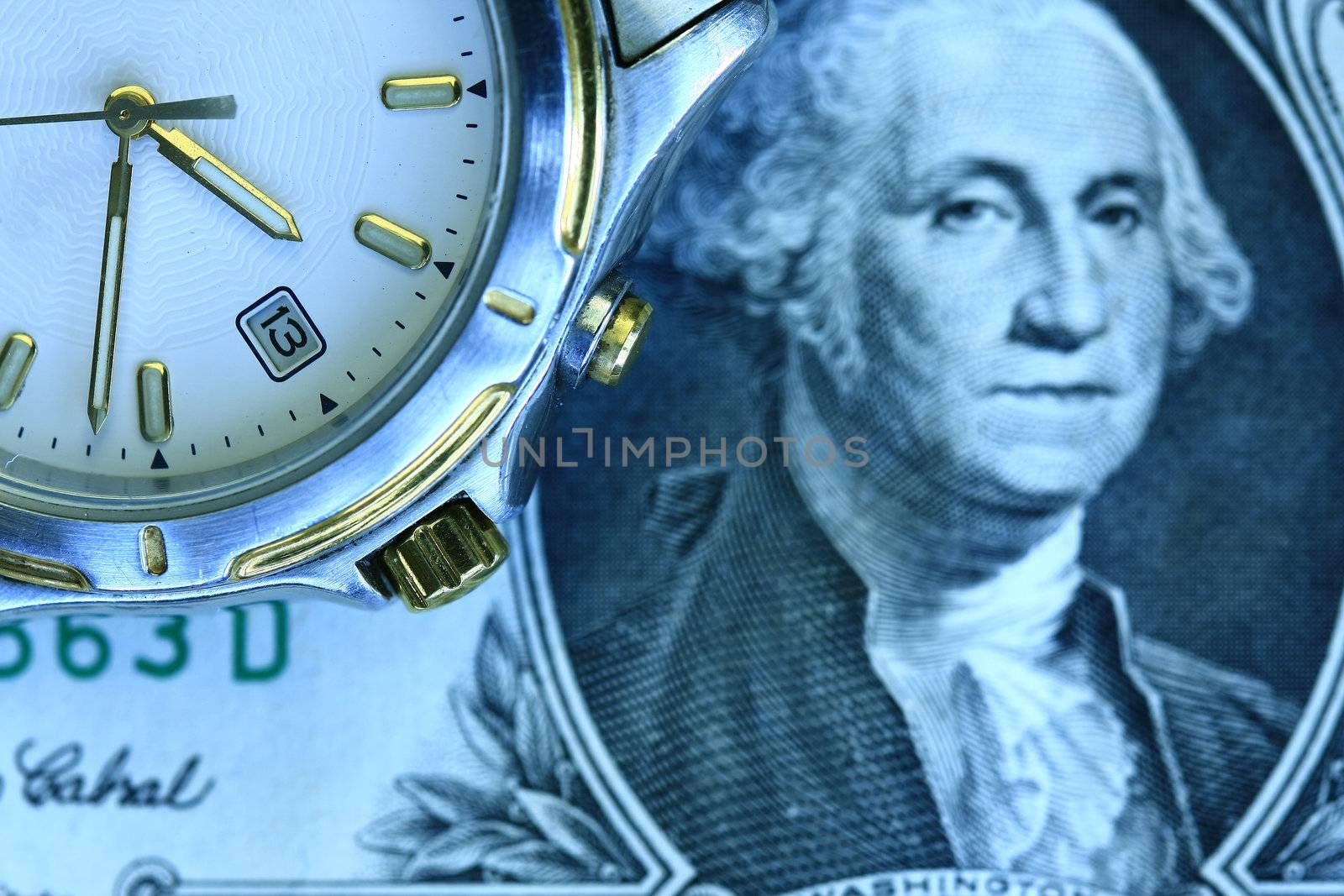 Time and money concept - watch and dolar bill in blue tinge.