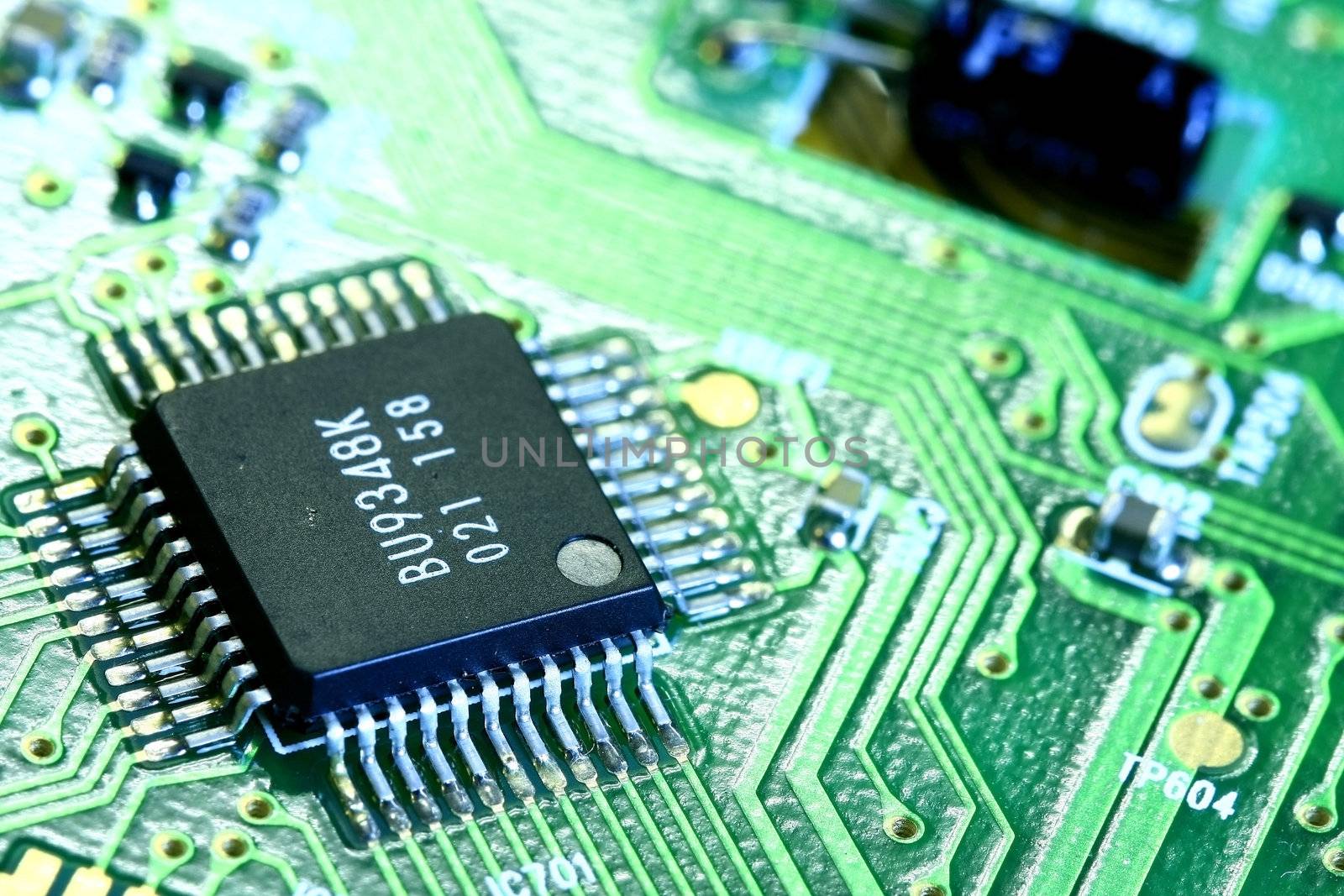 PCB board and electronic components focus on microchip and circuit.