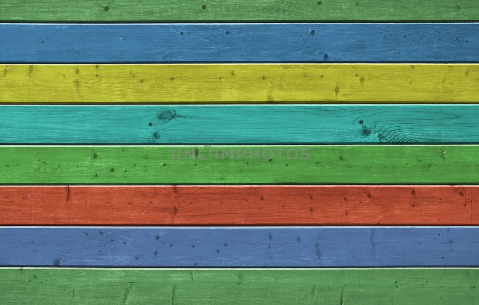 Wall of pine multicolor wood board. Lining closeup, frontally.