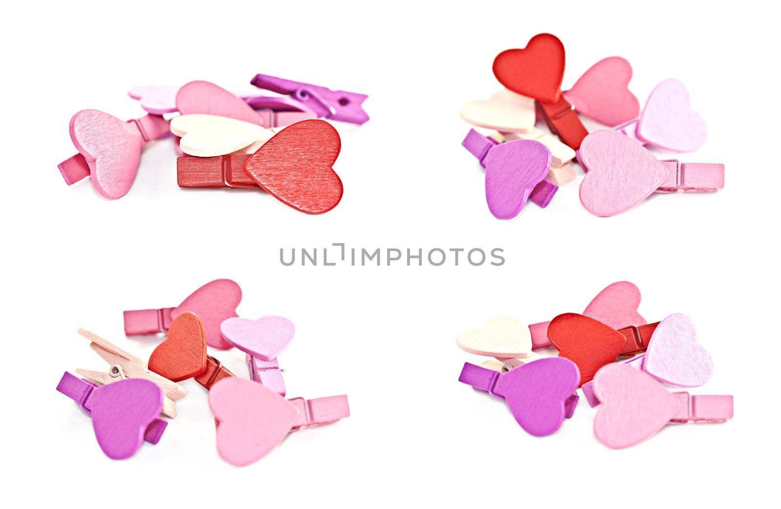 Colorful wooden pegs with a heart on a white background. Macro photography.