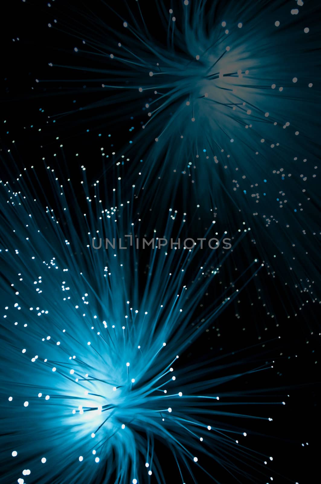 Fibre optic light strands with foreground in focus.