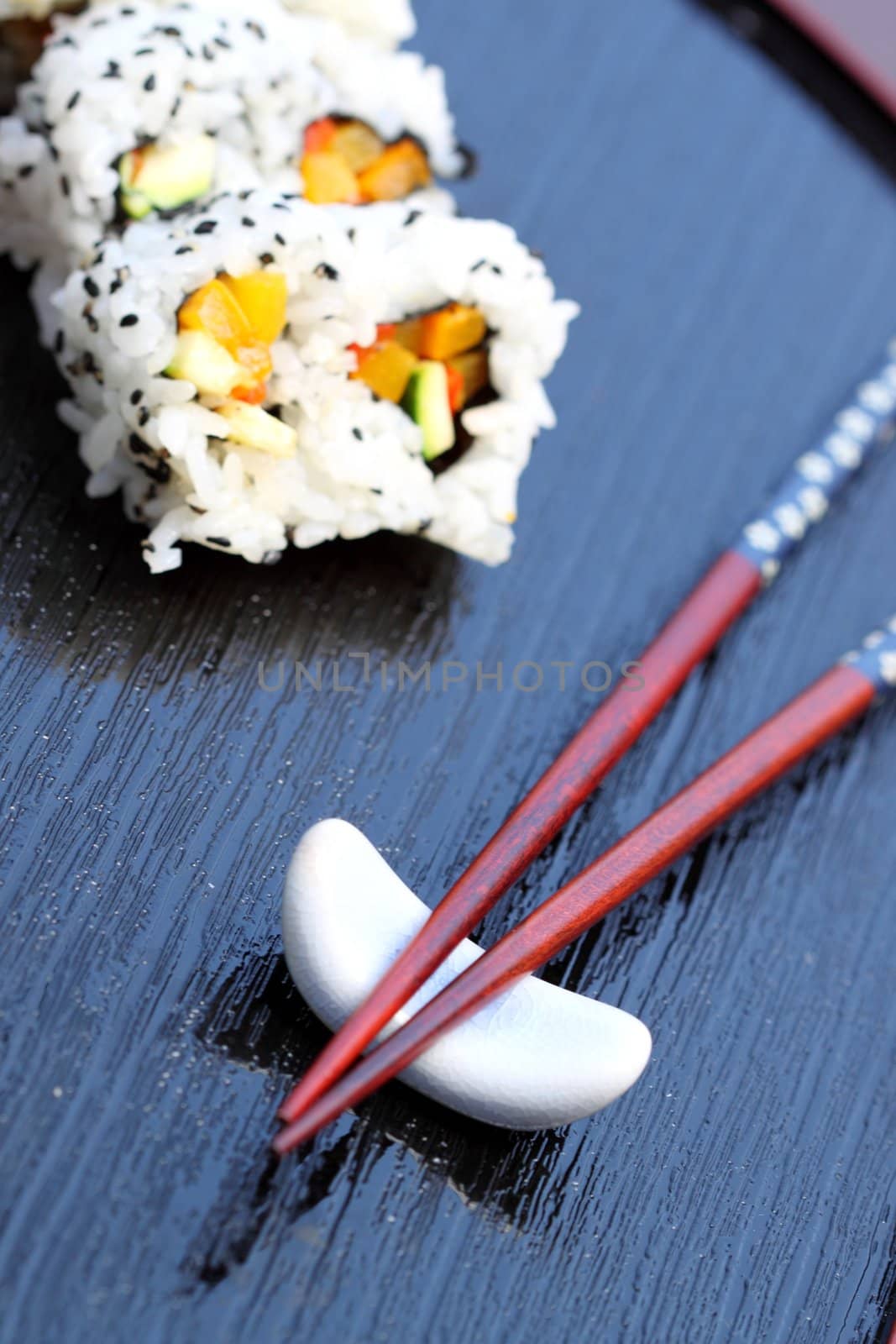 healthy very popular Japanese food sushi with chopsticks