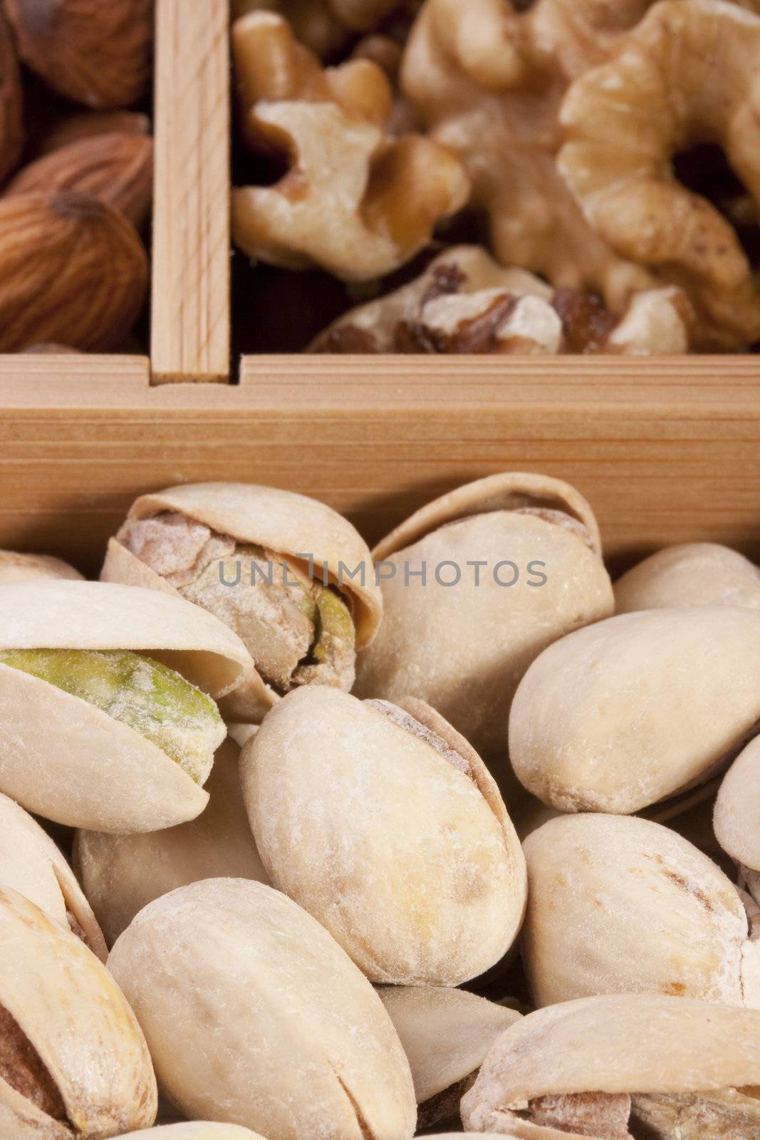 Nuts of different grades in a wooden box.