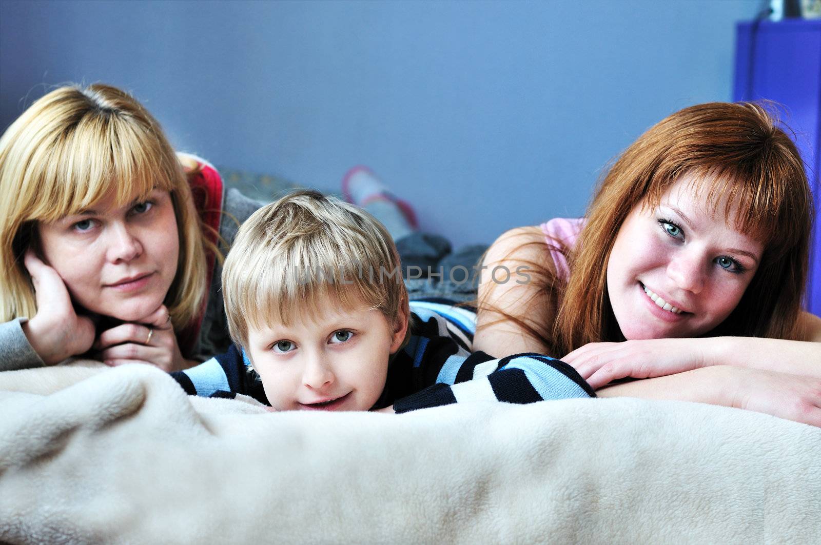 boy with his older sister and mother - selective focus 