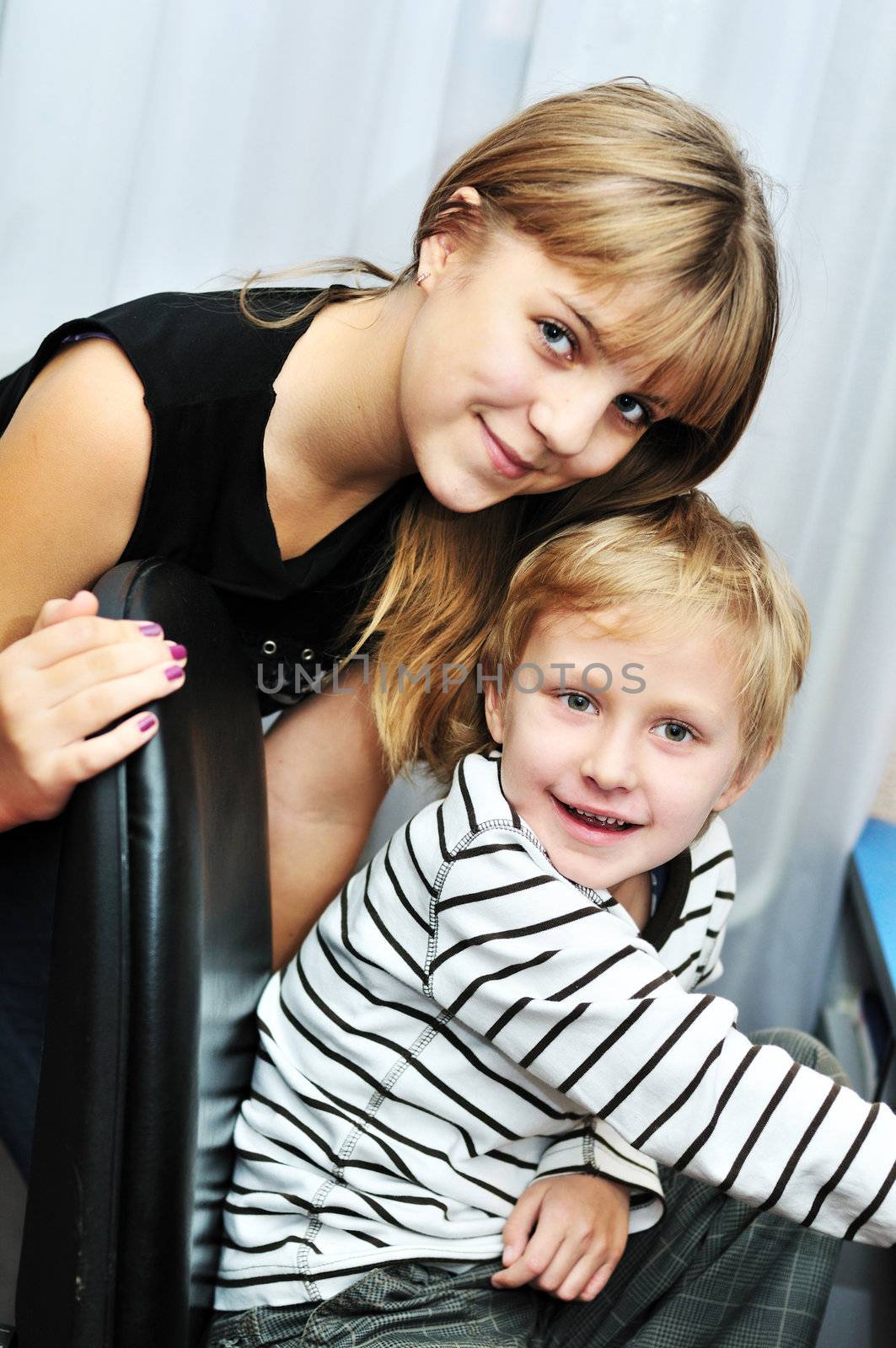 brother and sister at home - focus on the boy's face