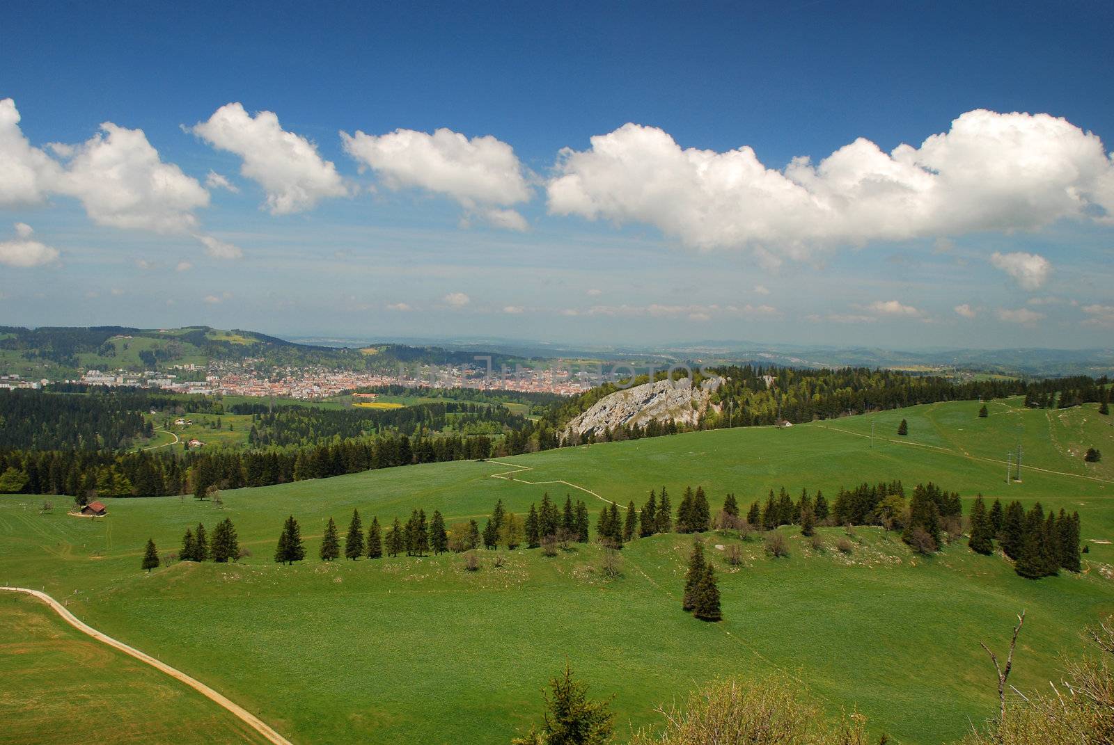 Jura hills and La-Chaux-de-Fonds city seen from Tete-de-Ran by dariya64