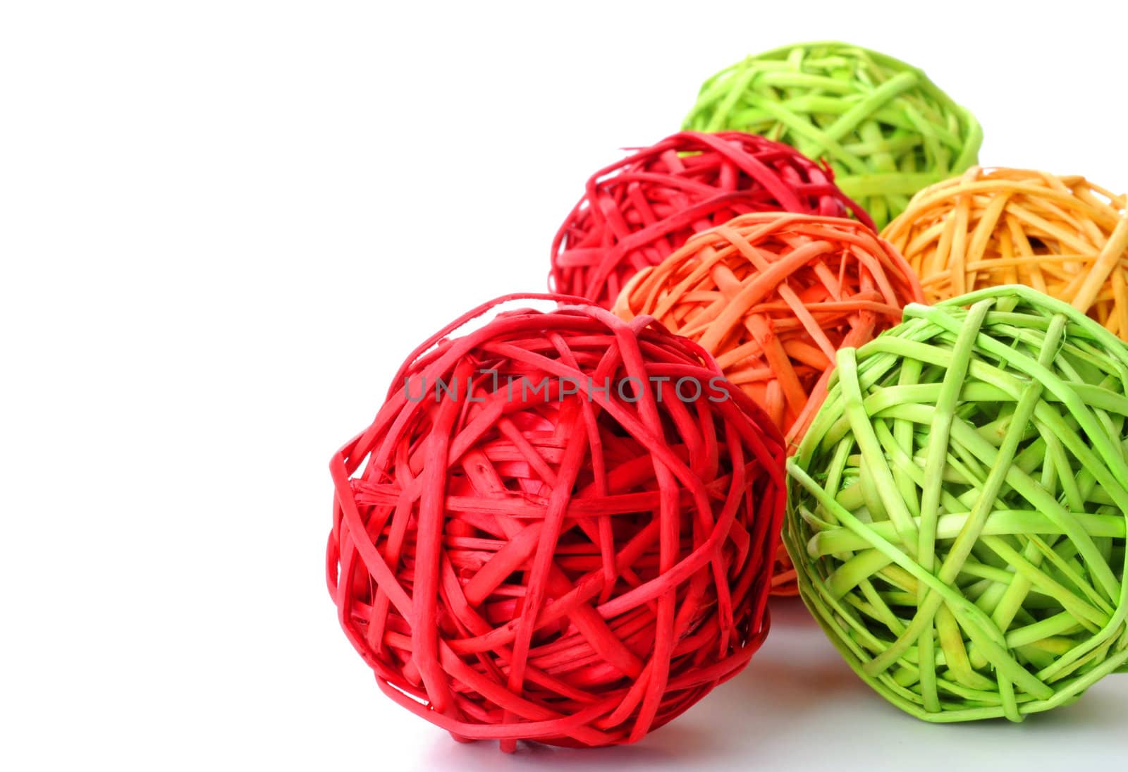 Bold and colorful woven wicker spheres for a background.