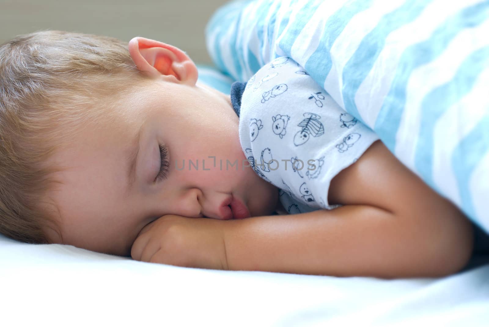 Deep sleep - Little boy sleeping with fist