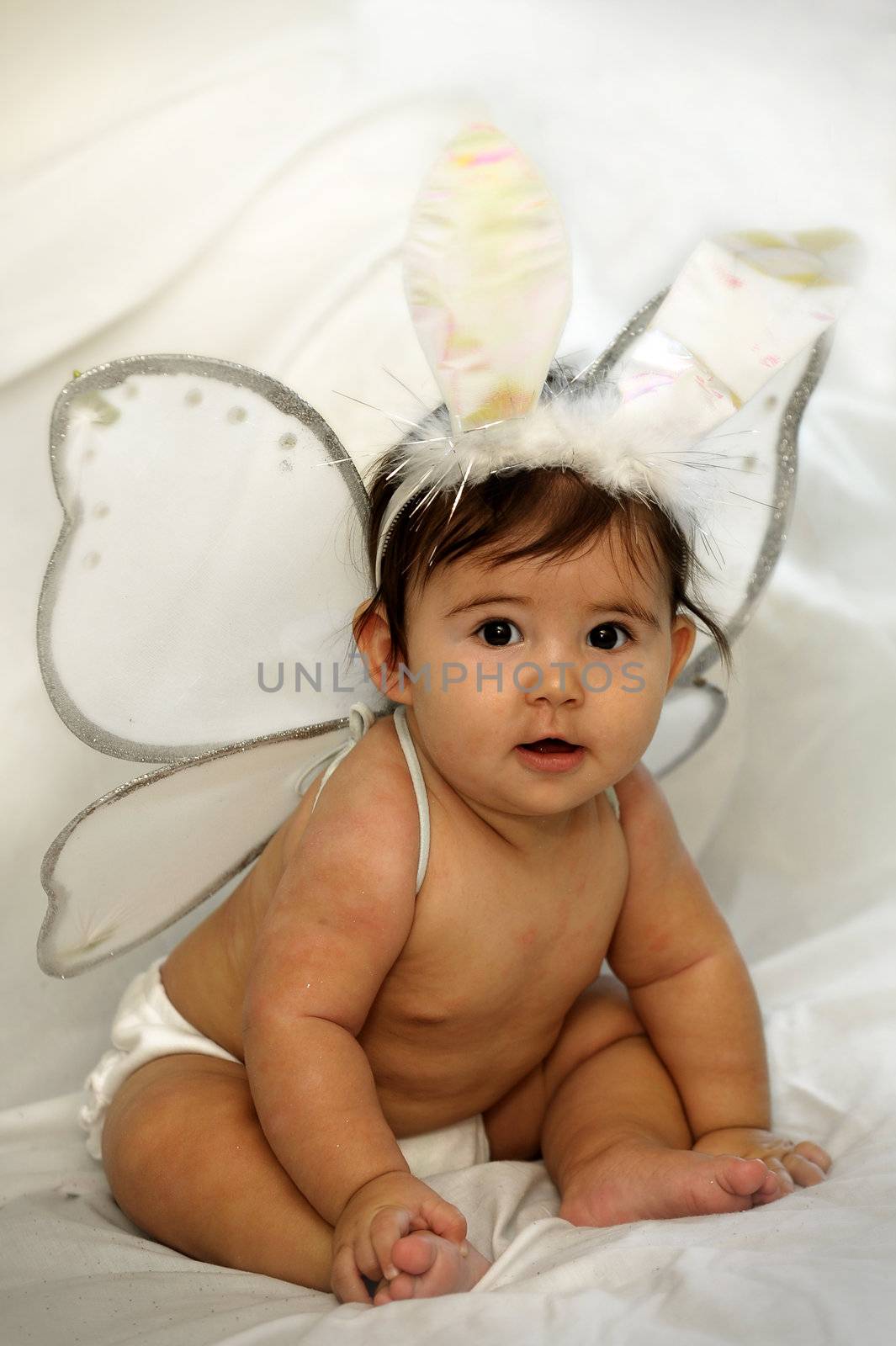 cute baby sitting and smiling with angel wings and bunny ears by Ansunette