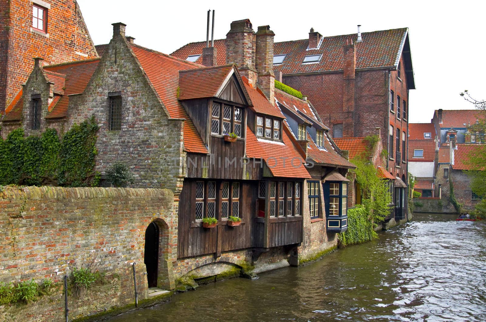 Classic view of channels of Bruges. Belgium. Medieval fairytale city. Summer urban landscape.