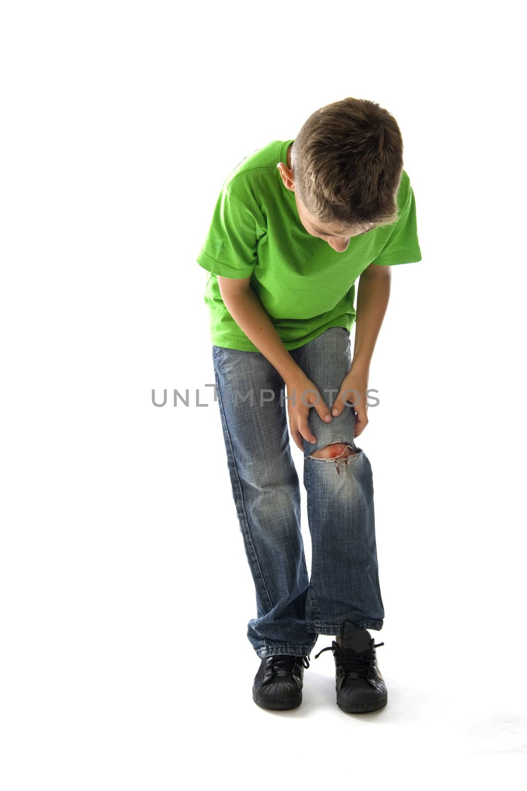 a young boy with a painful leg on white