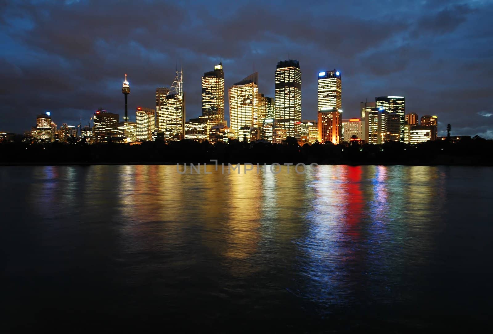 sydney CBD at night, skyscrapers reflection in water, photo taken from Royal Botanic Gardens