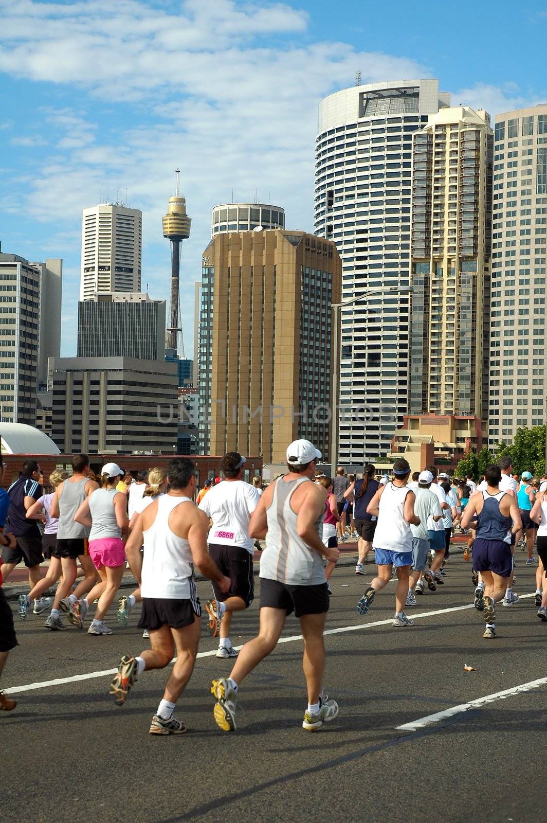 Sydney marathon on harbour bridge, sydney tower in background