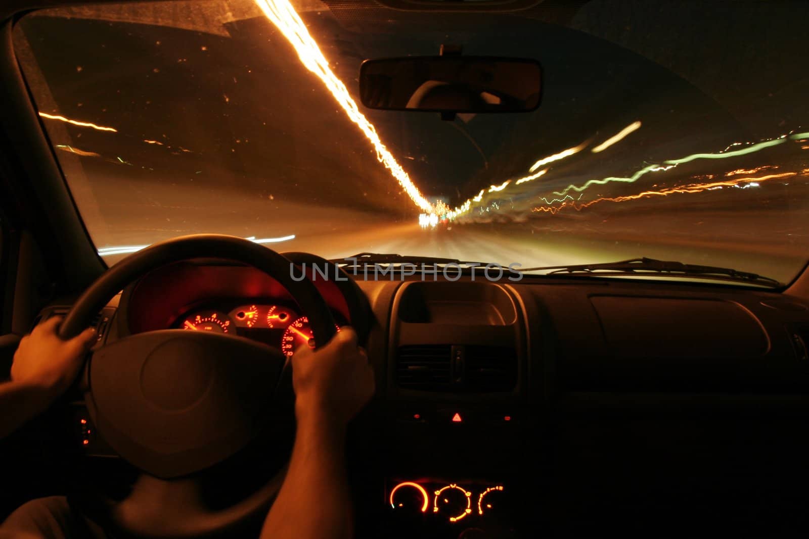 photo of car interior, car in motion, man arms