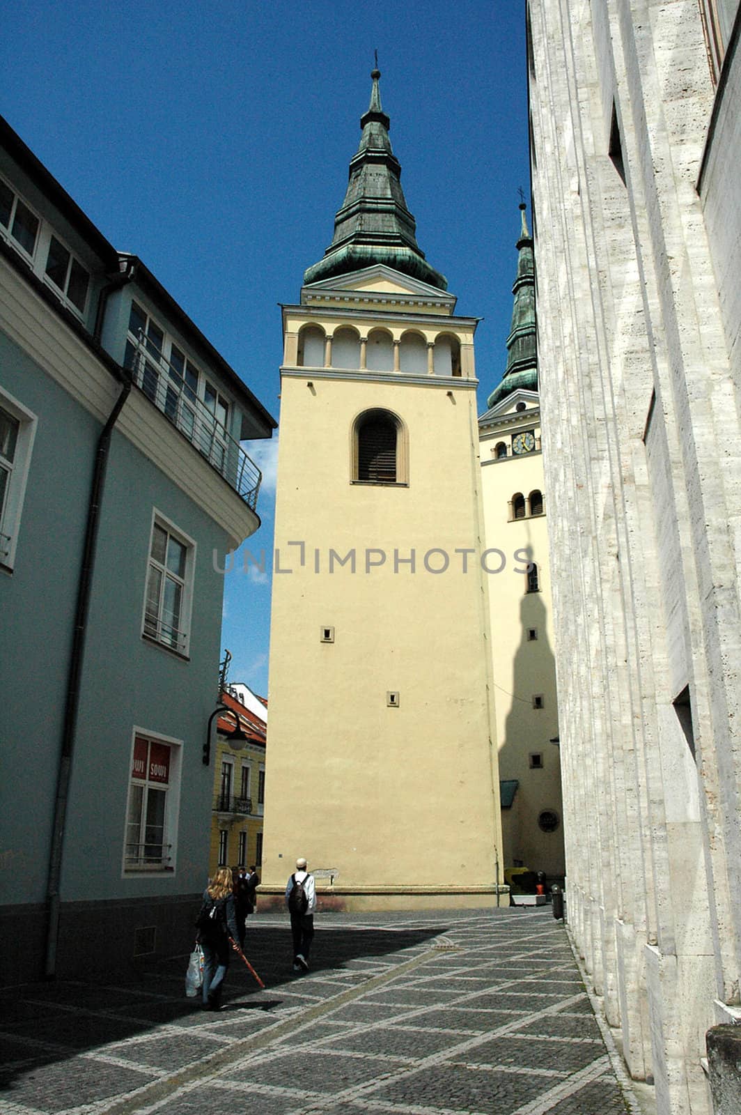alley to church tower in zilina, slovakia, 