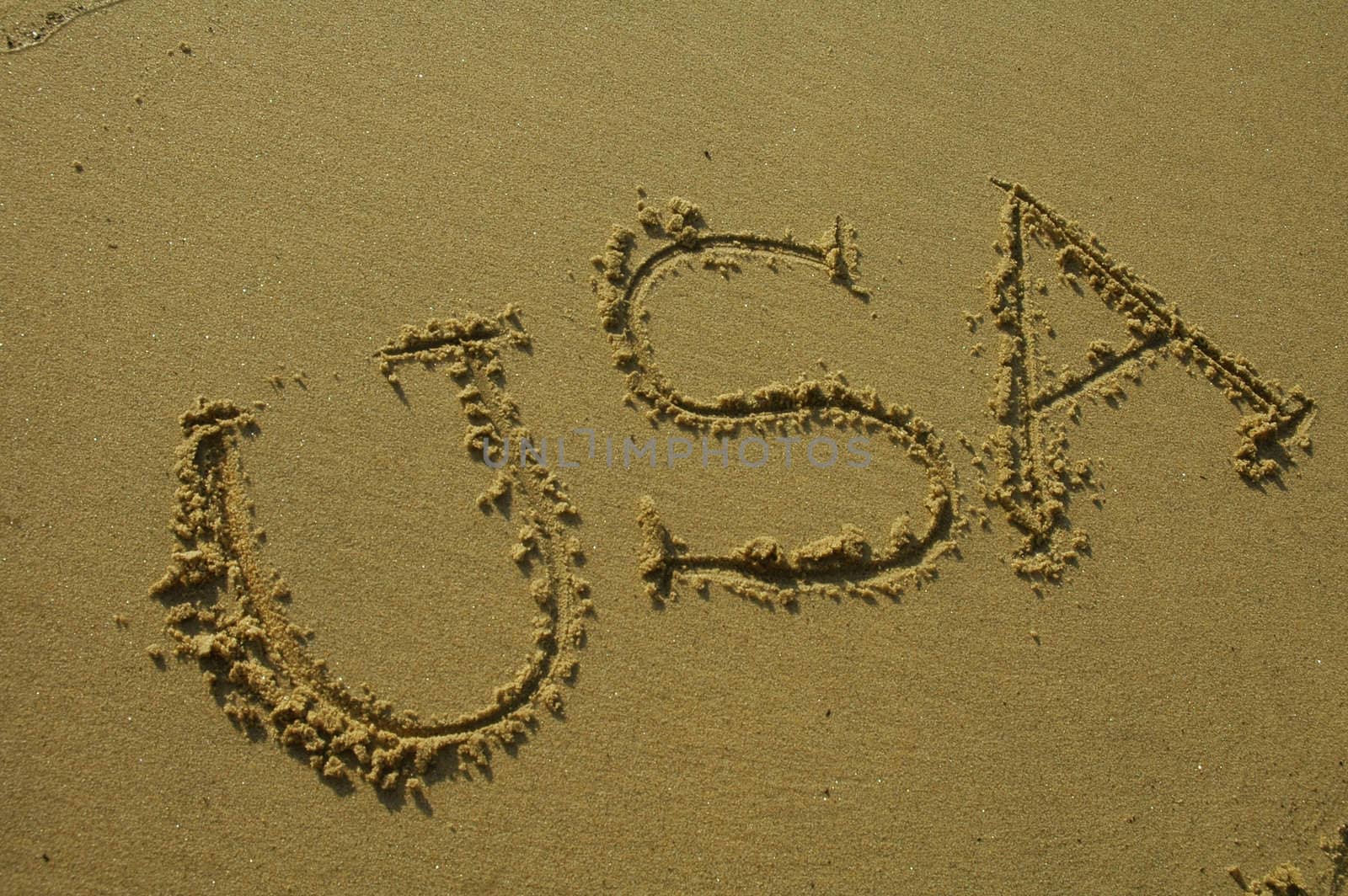 USA written in sand on a beach