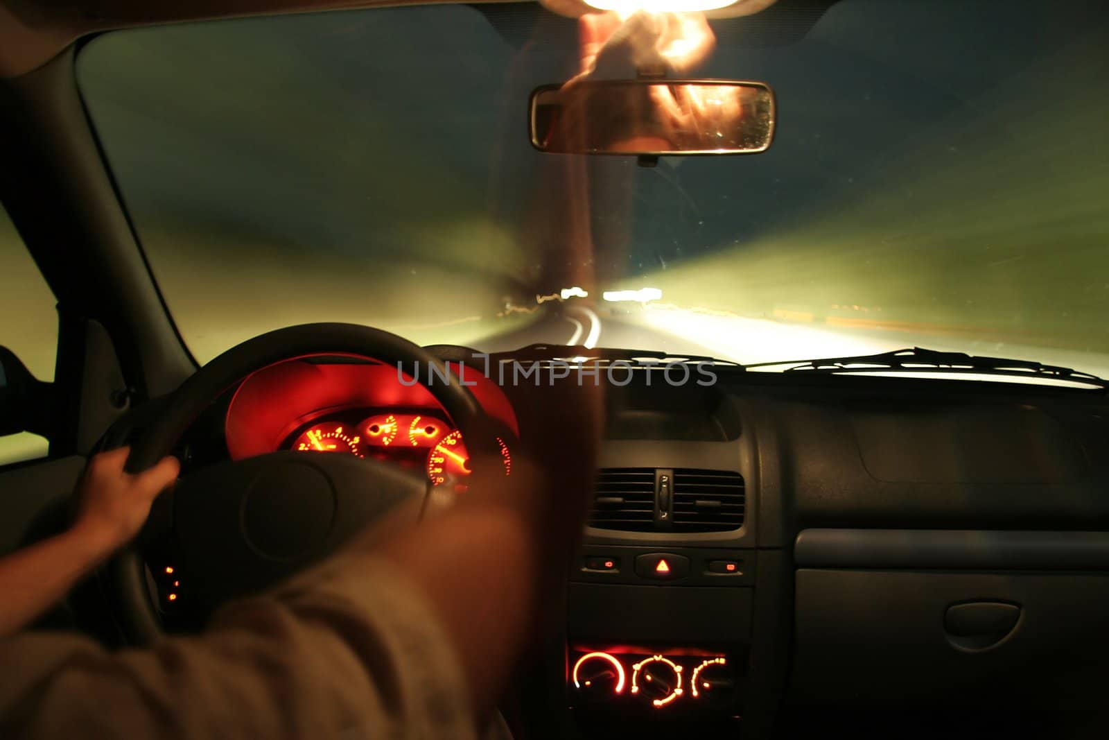 photo of car interior, car in motion, man arms