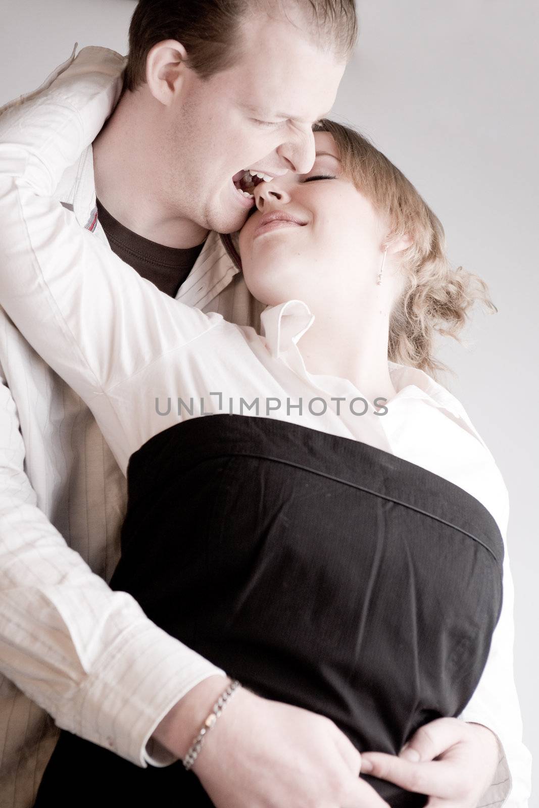 Portrait of a young biting loving couple by DNFStyle