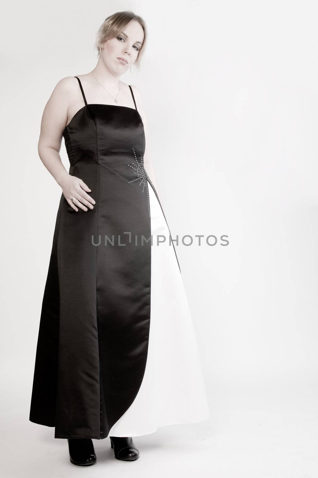 Portrait of a blond curly woman in a gala dress by DNFStyle