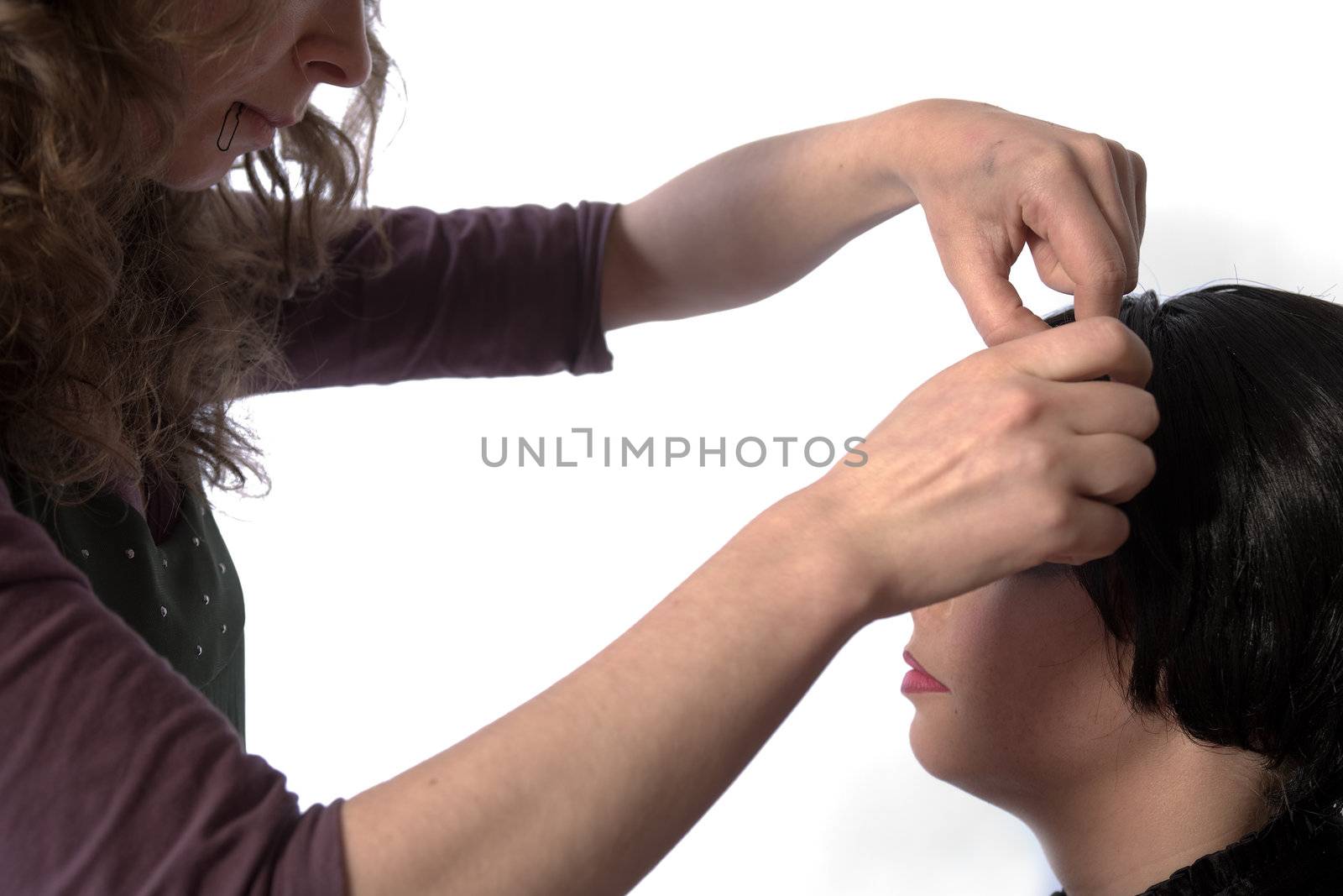 Studio image of hairdresser at work