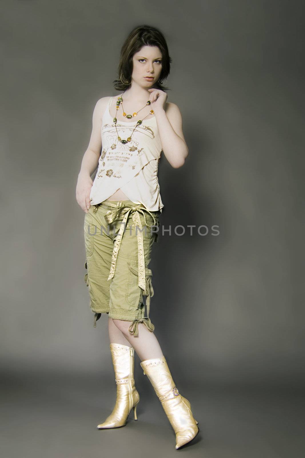 a model posing in the studio with jewellery in a fashionable way