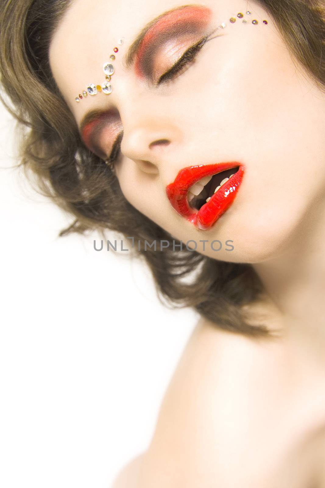 Portrait of a model face with her lips opened.