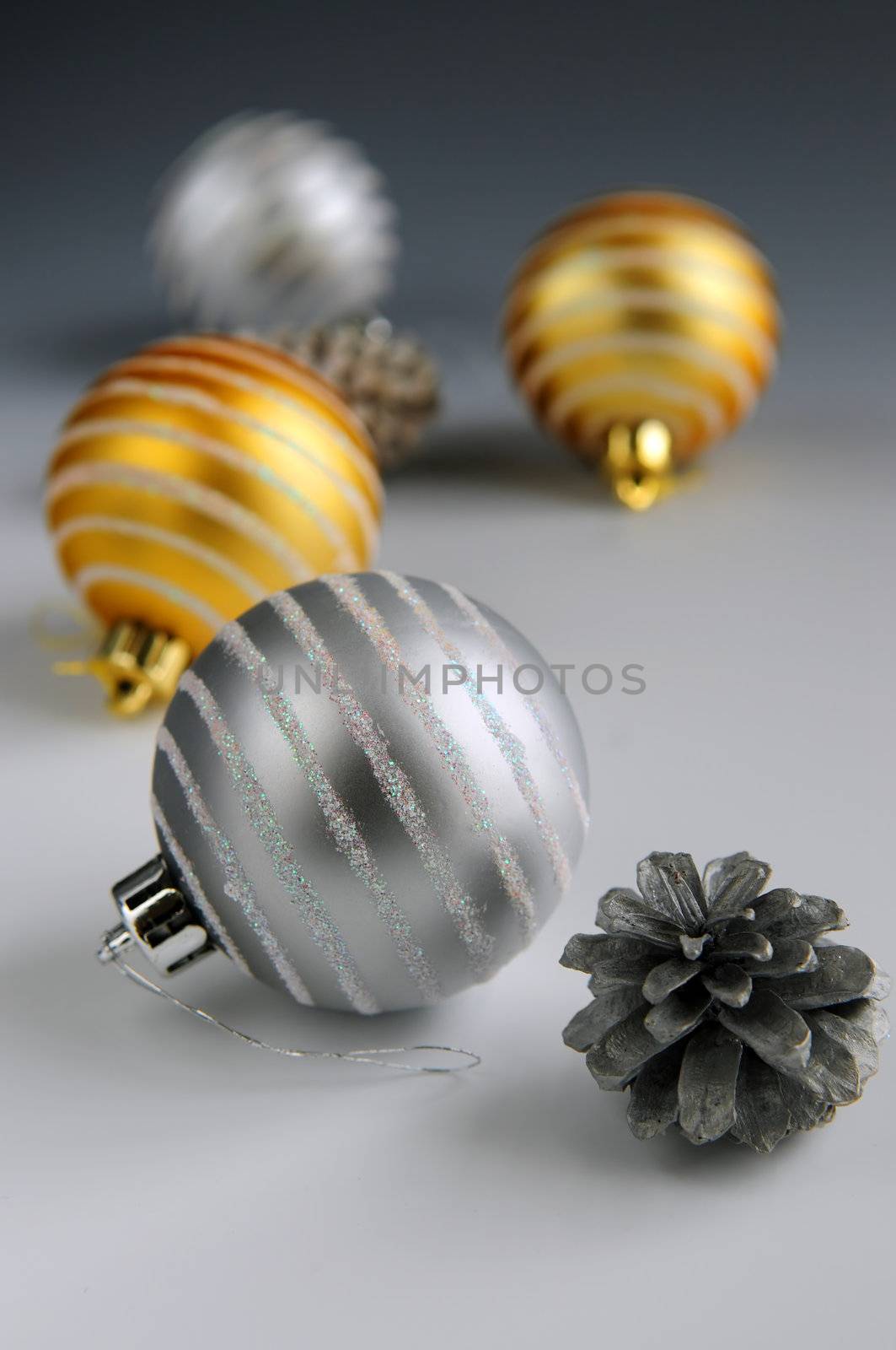 Christmas arrangement with glass bauble ornaments and pine cones