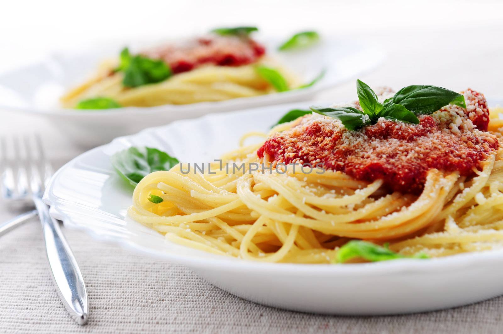 Pasta with tomato sauce basil and grated parmesan