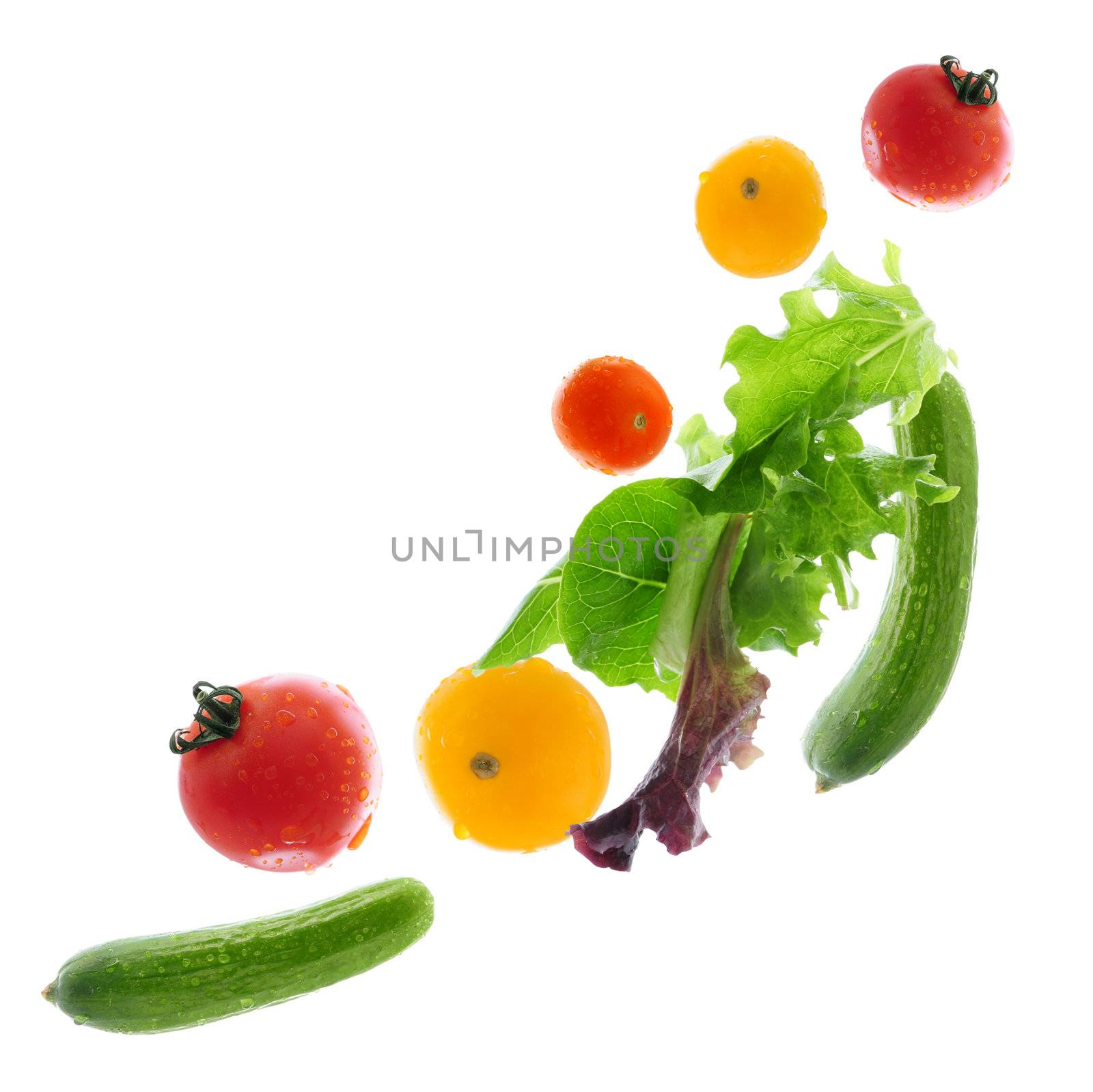 Assorted fresh vegetables flying isolated on white background