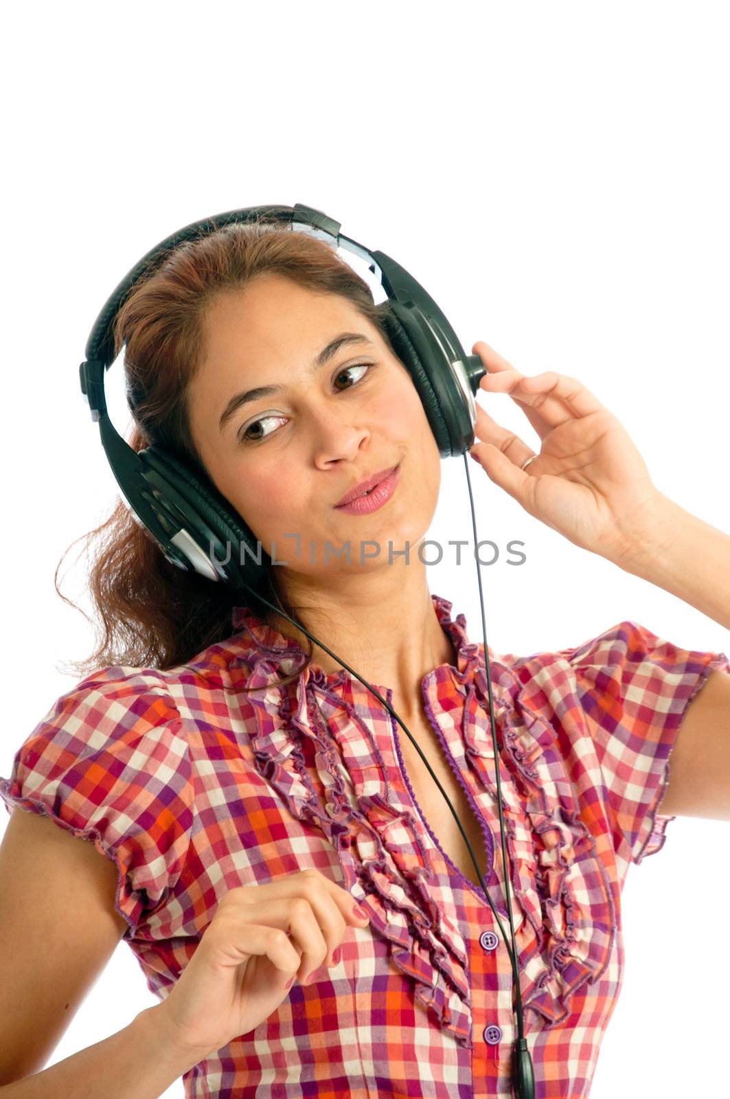 Multi-ethnic woman listening to music on her headphones. Isolated on white 