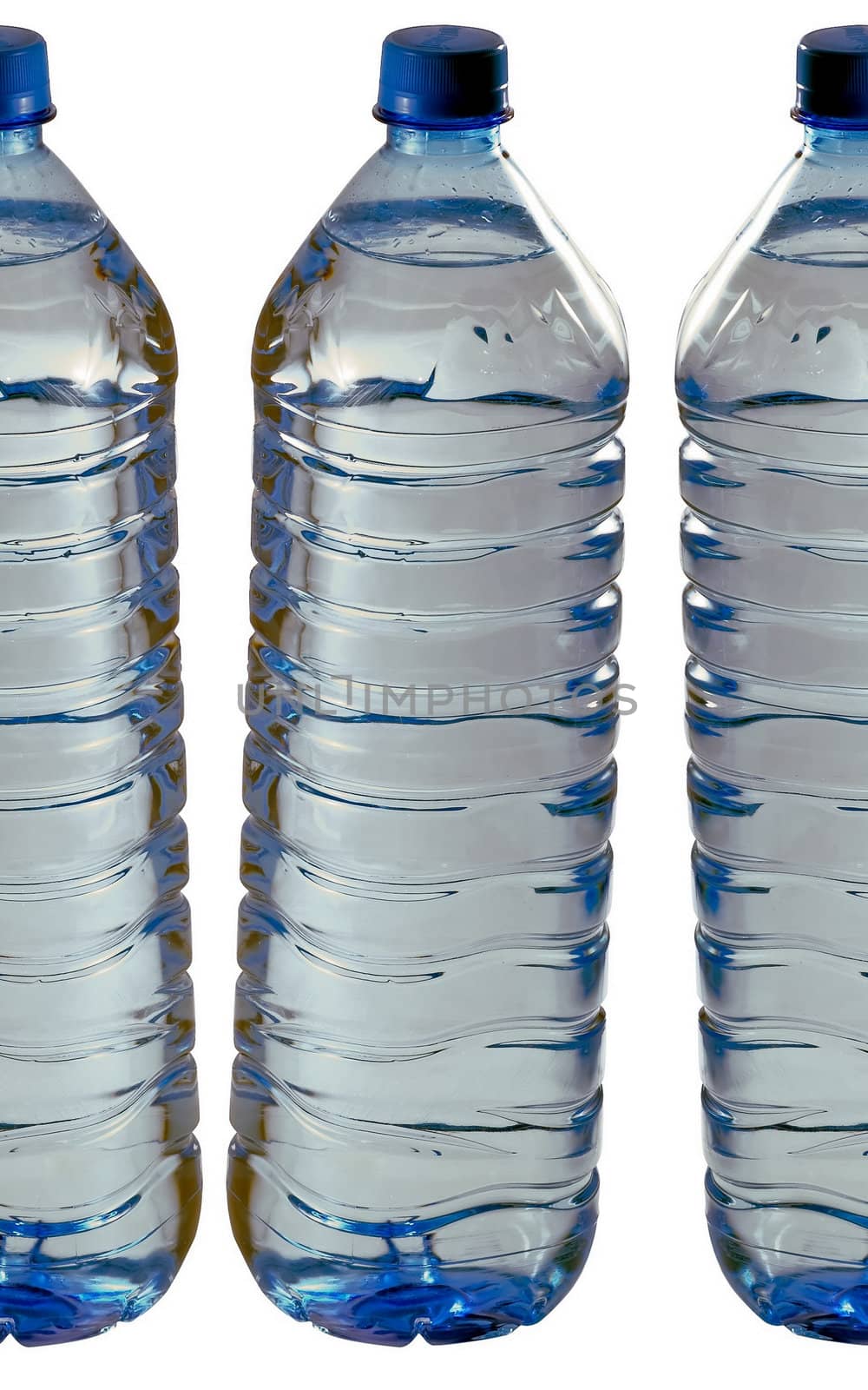 Blue bottles of mineral water isolated on white.