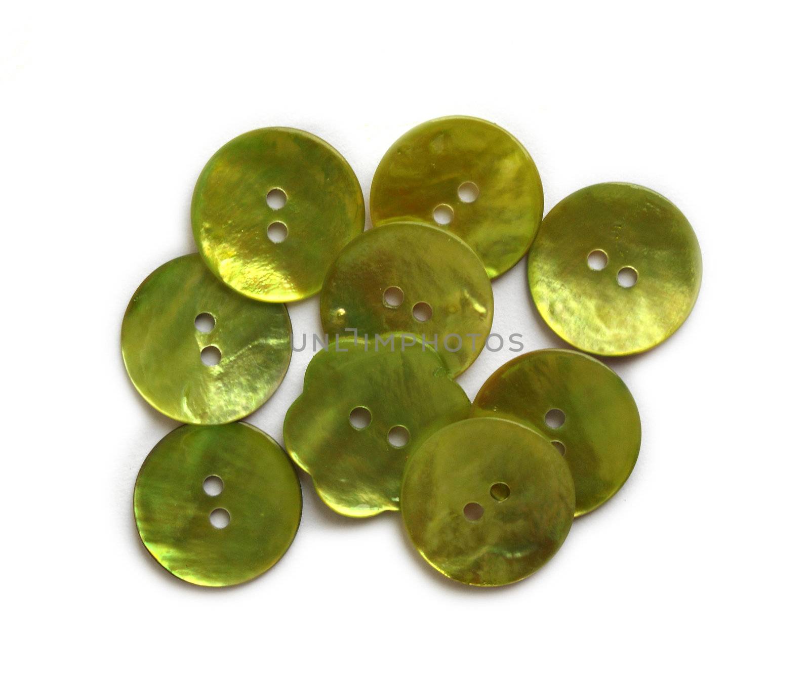 Green mother of pearl buttons on white background