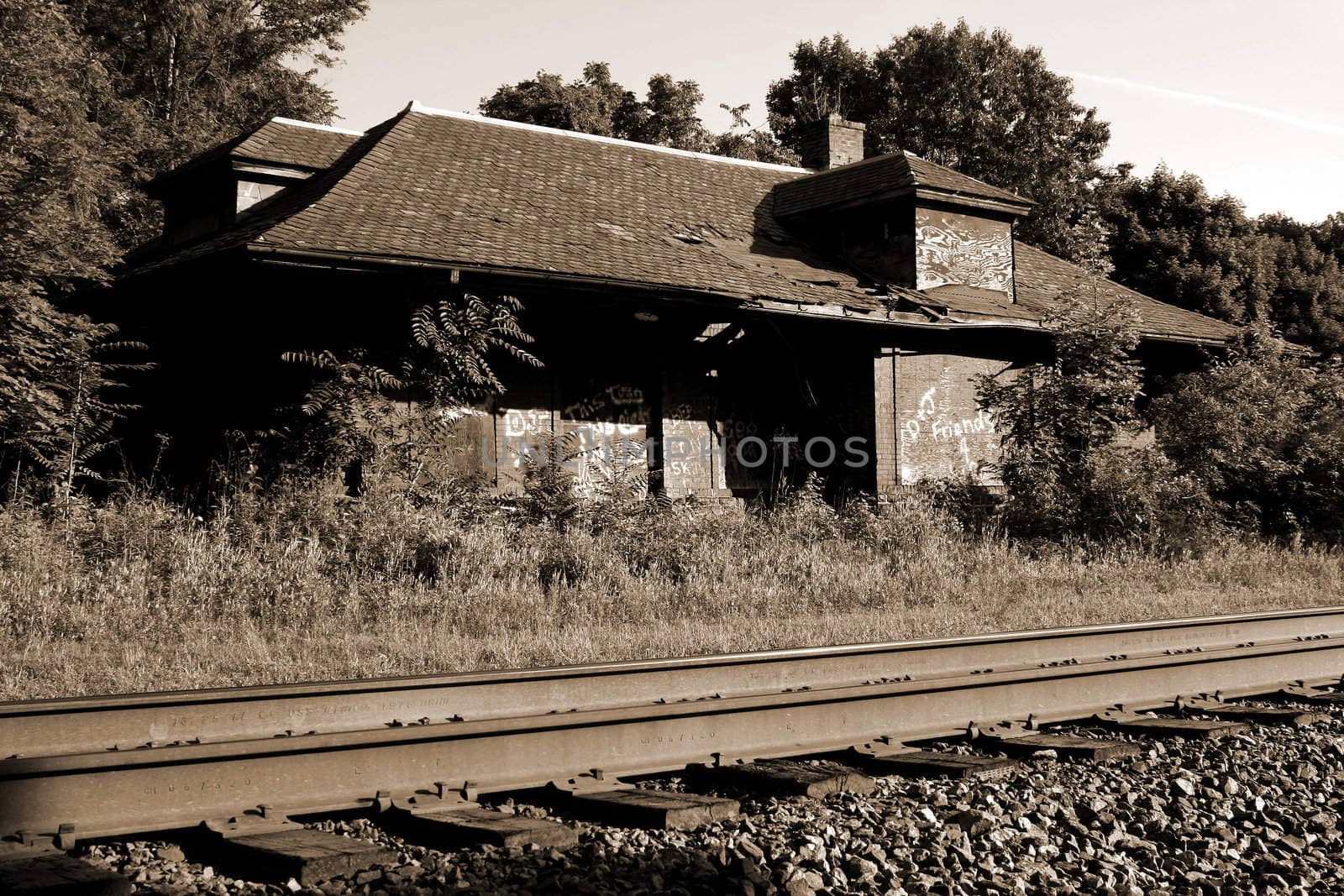 A Abandoned train station and railroad tracks