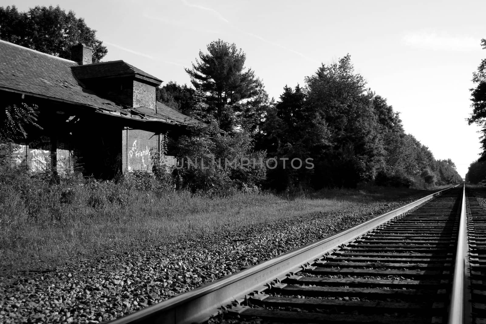 A Abandoned train station and railroad tracks